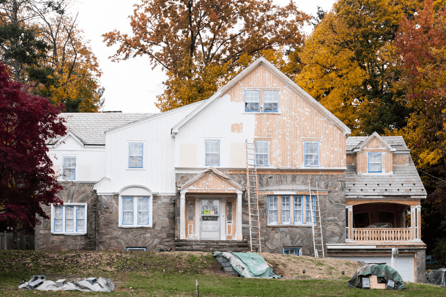 Old home with visible exterior changes that may lack permits