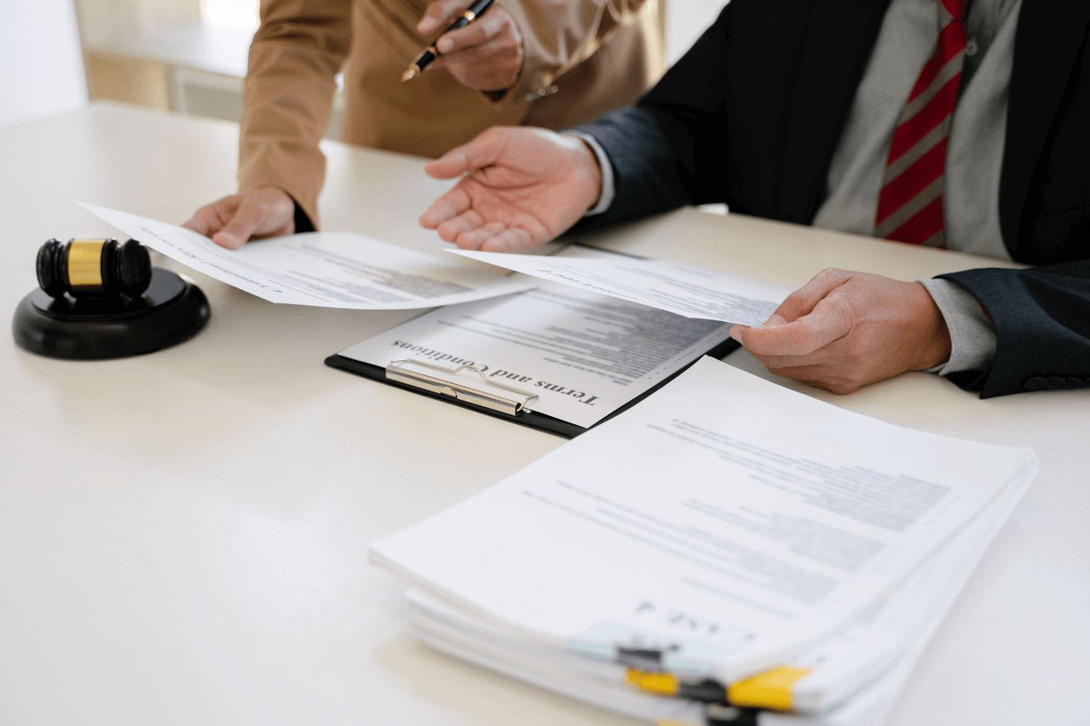 Judge reviewing documents for probate sale approval