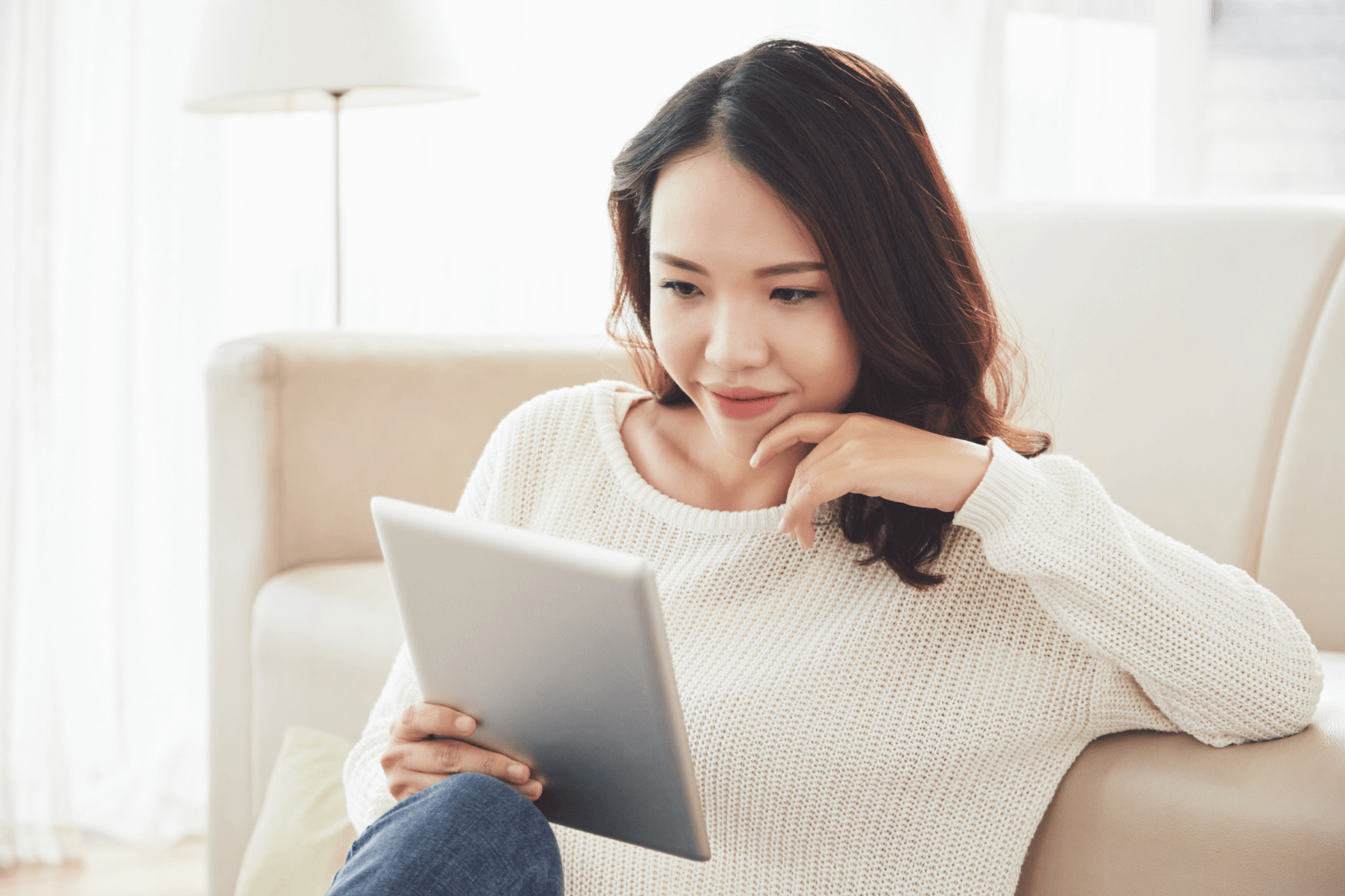Home seller browsing buyer reviews on  tablet