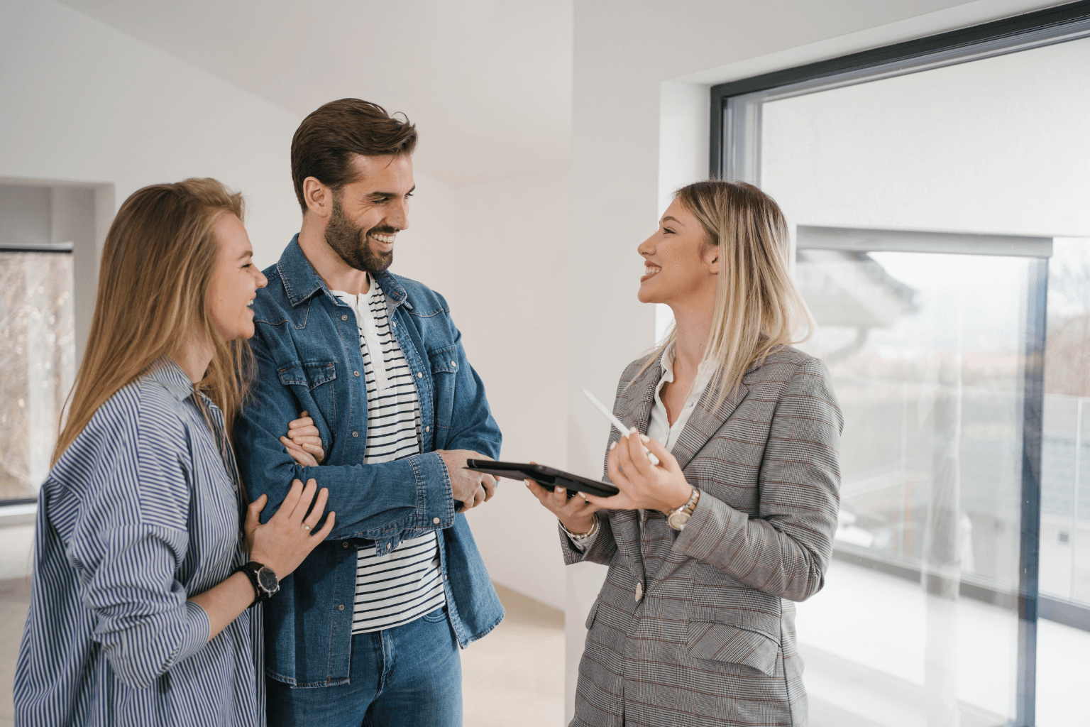 Real estate agent meeting with siblings inside the inherited home
