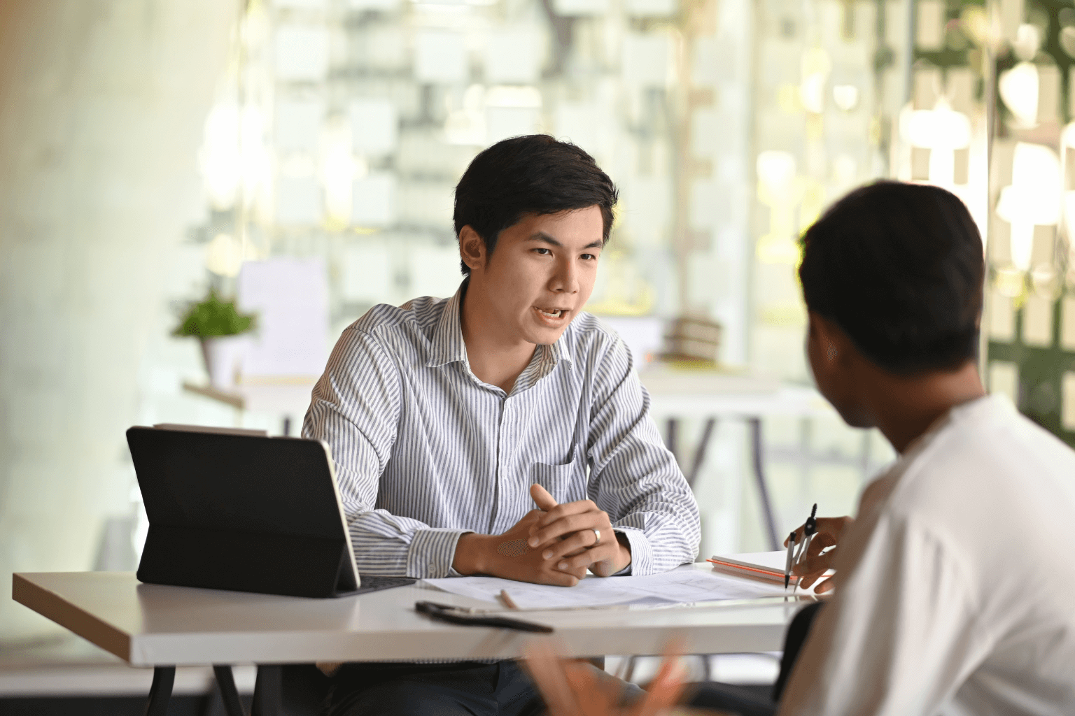 Real estate agent discussing home pricing with seller