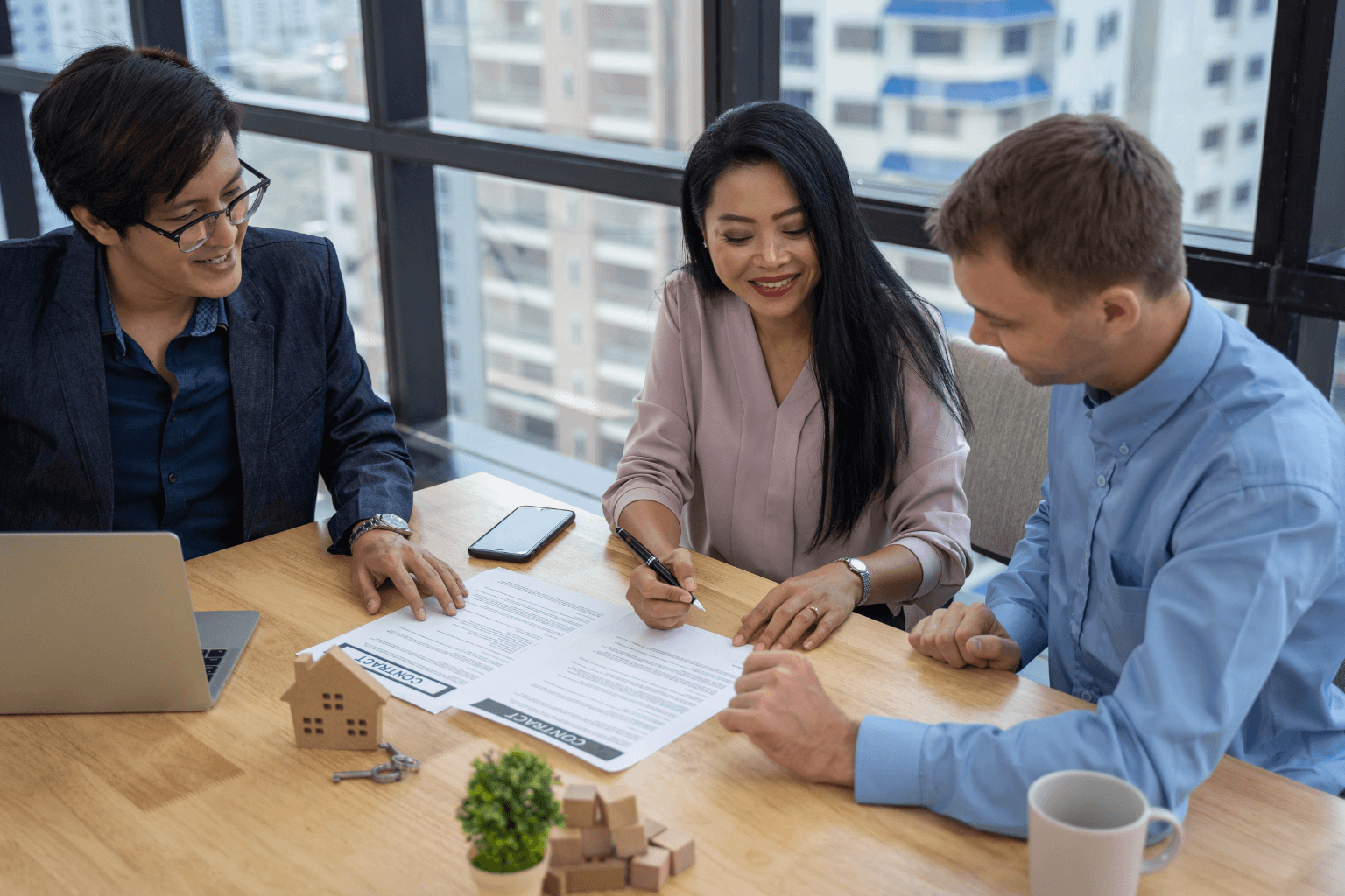 Buyer and seller reviewing closing documents