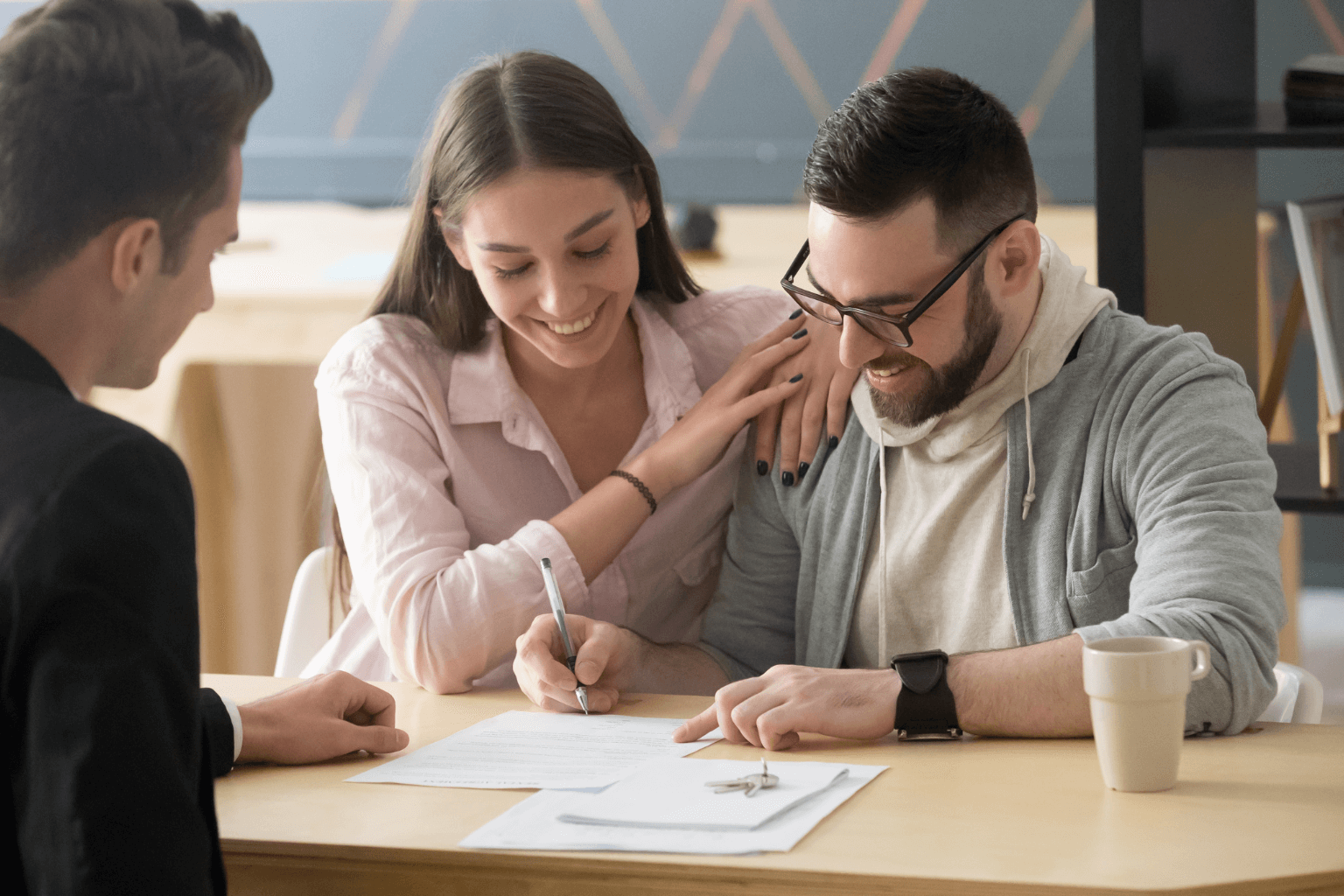 couple signing a real estate contract
