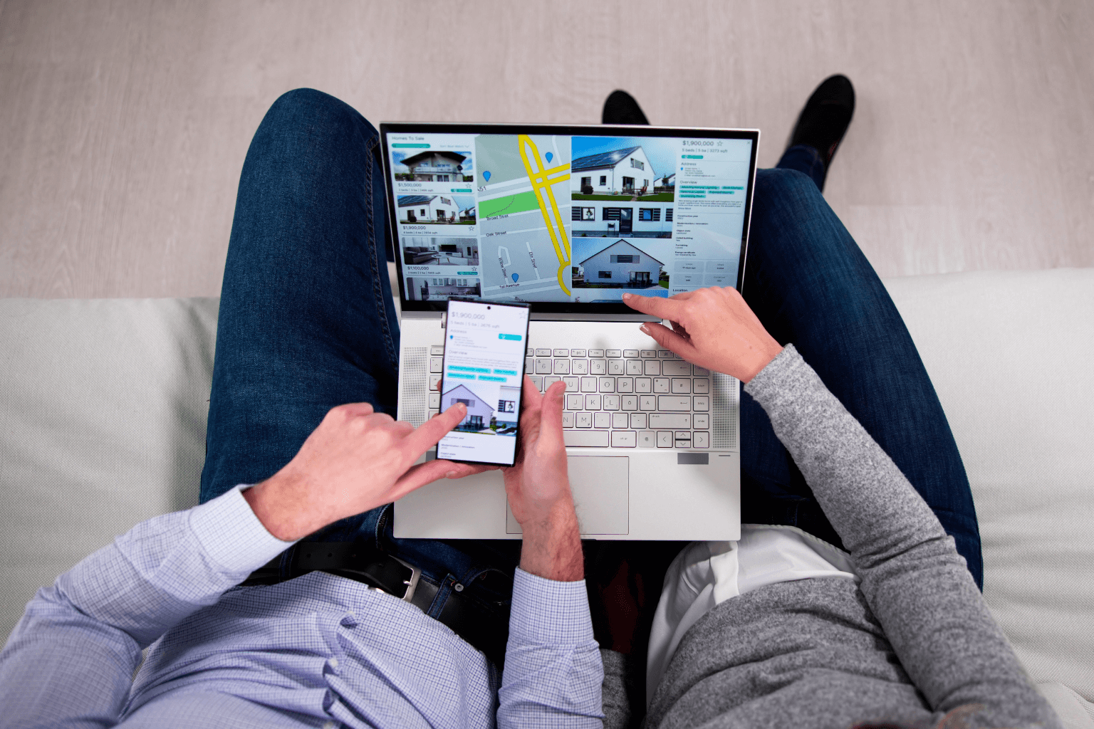 Real estate agent using laptop to analyze pricing