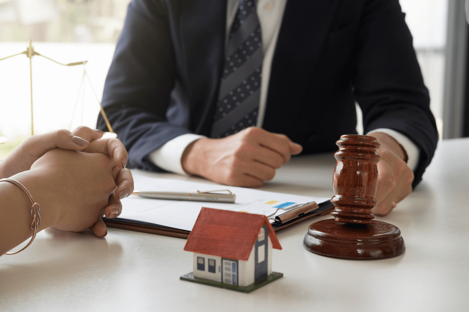 Real estate lawyer discussing title issues with a client