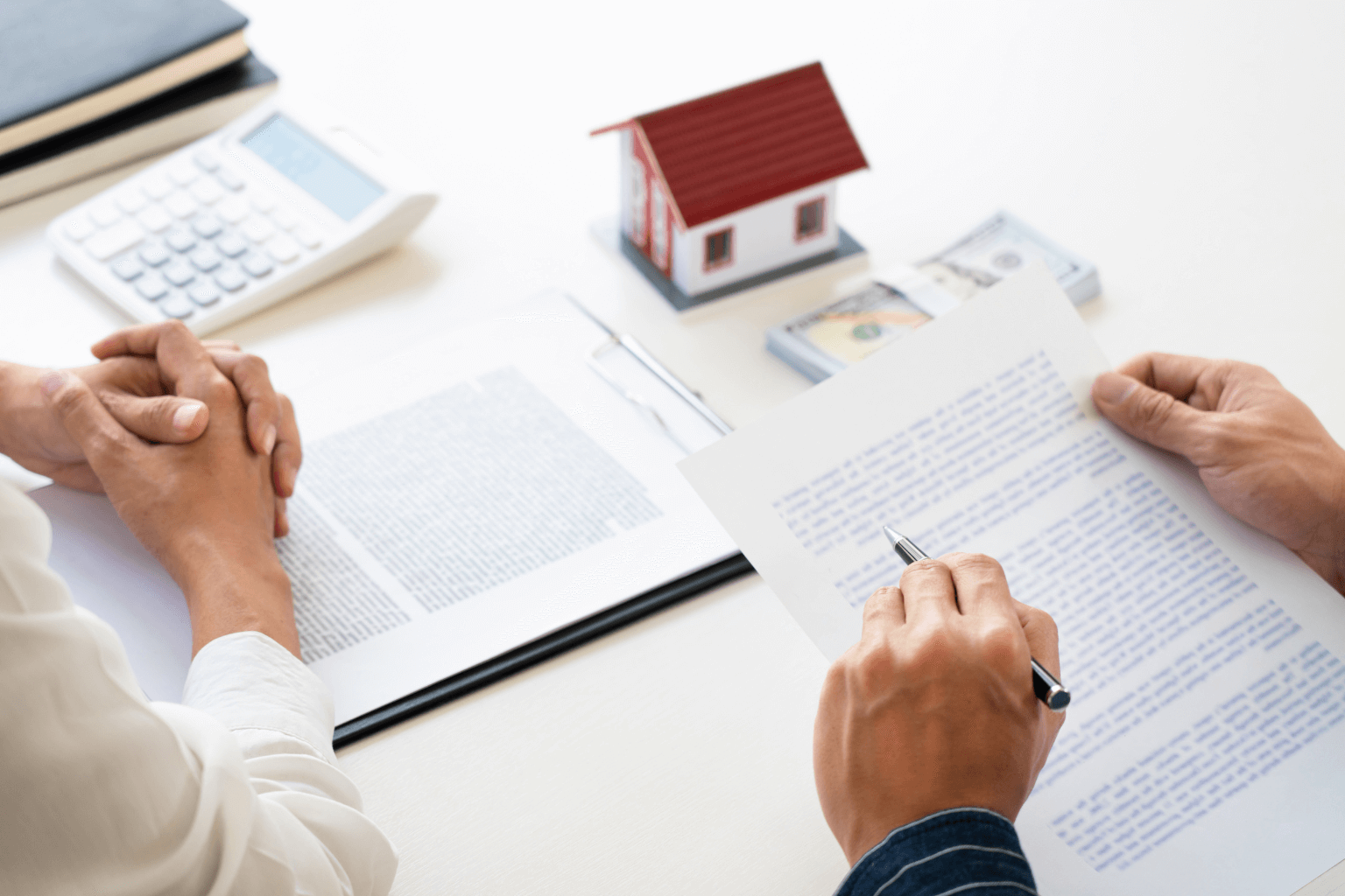 Legal documents and house keys on desk