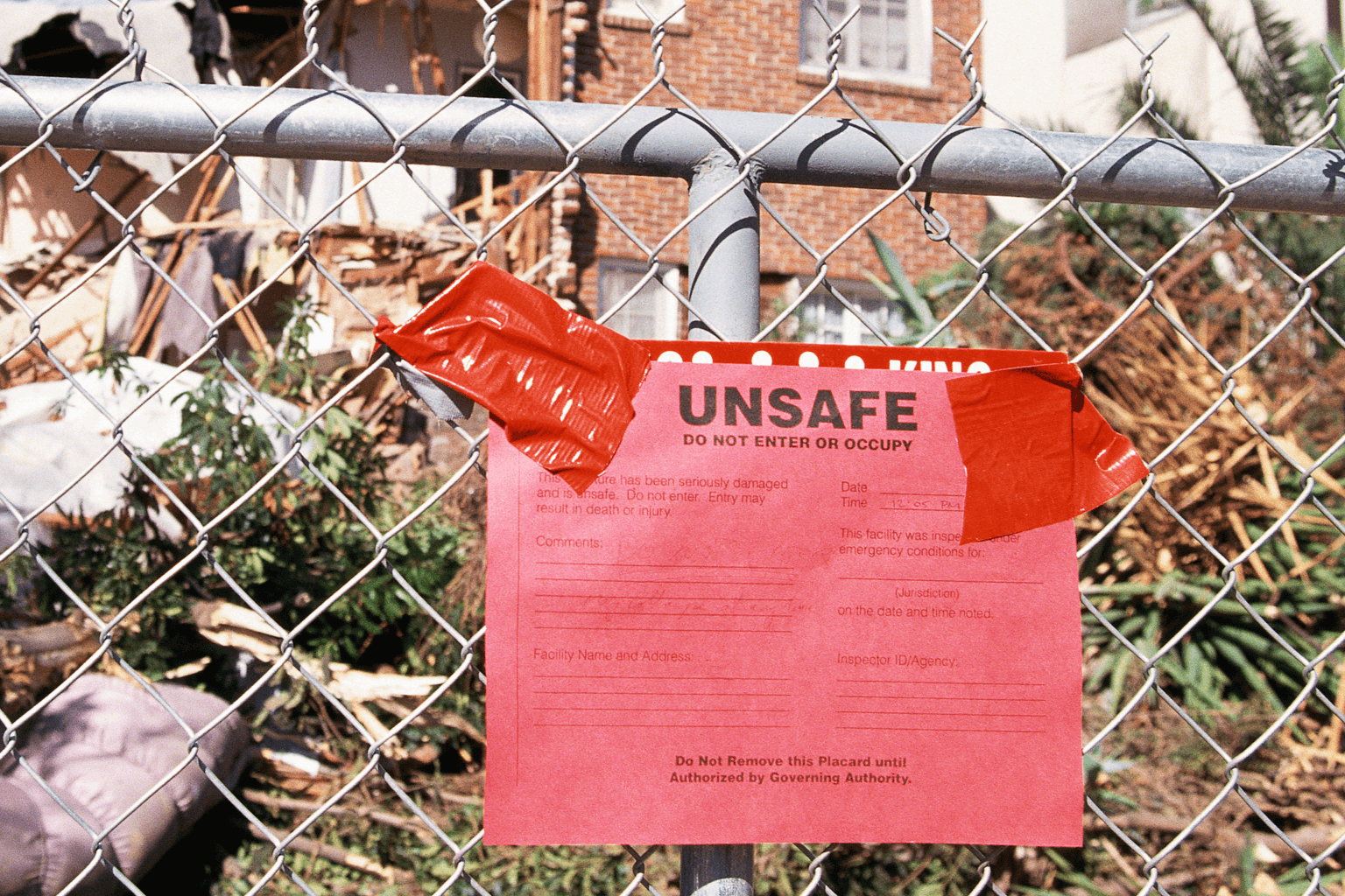 Red tag warning posted on front of house