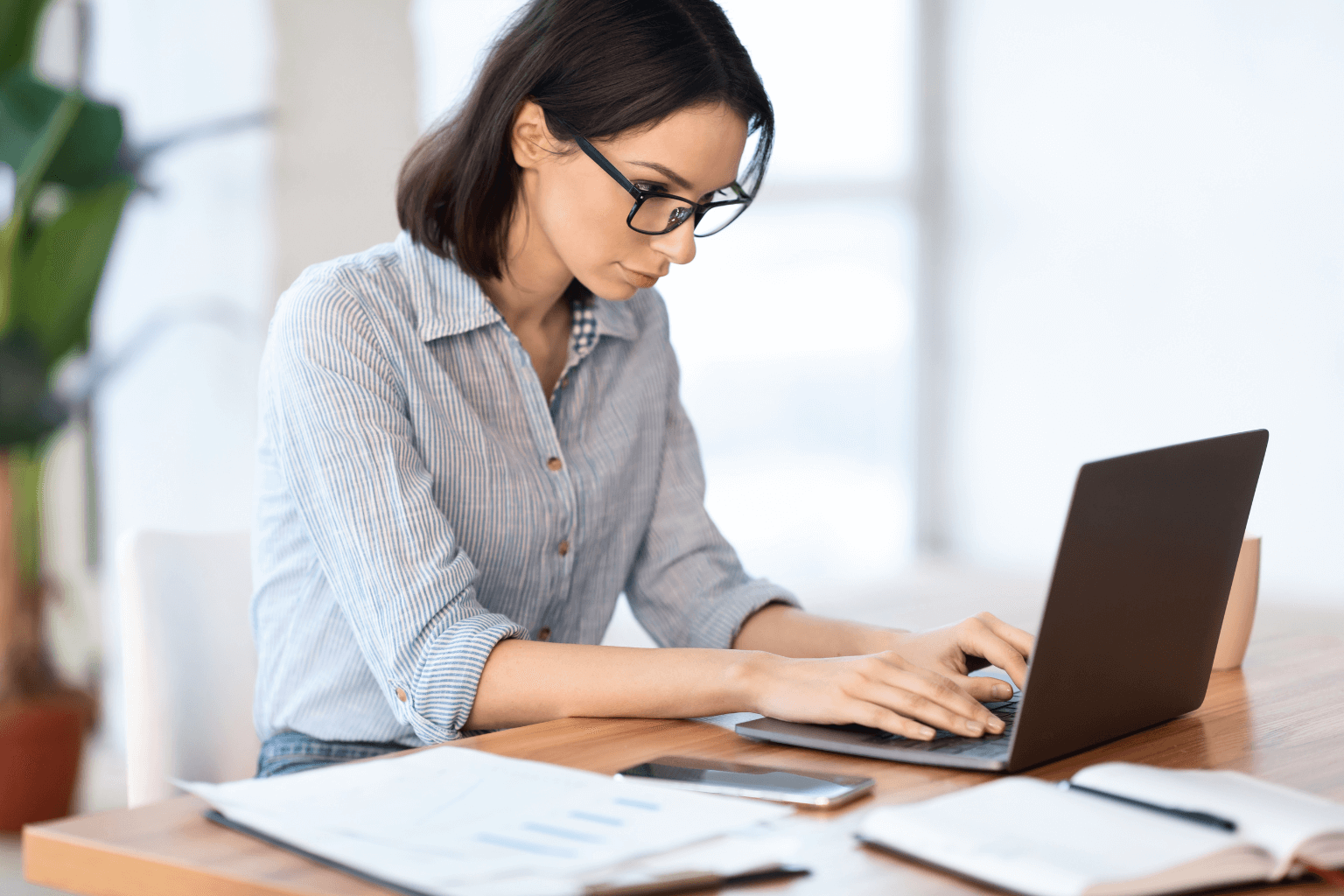 Person searching property records on a laptop