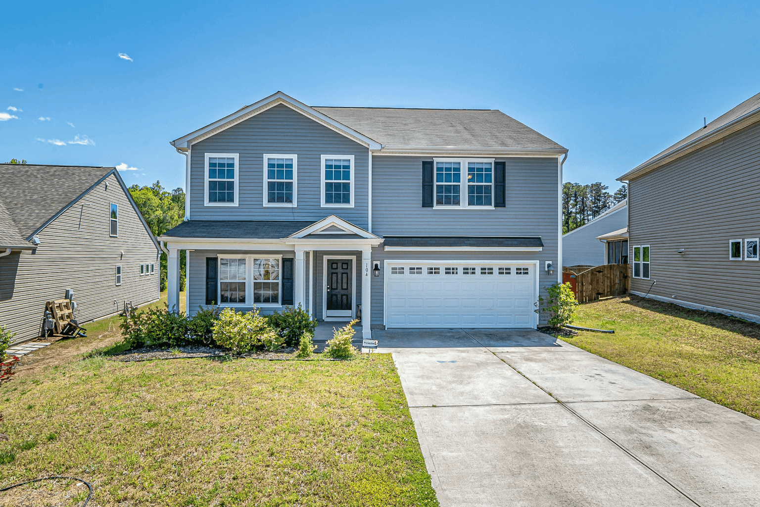 xterior of an older home with a large backyard, suitable for a septic system