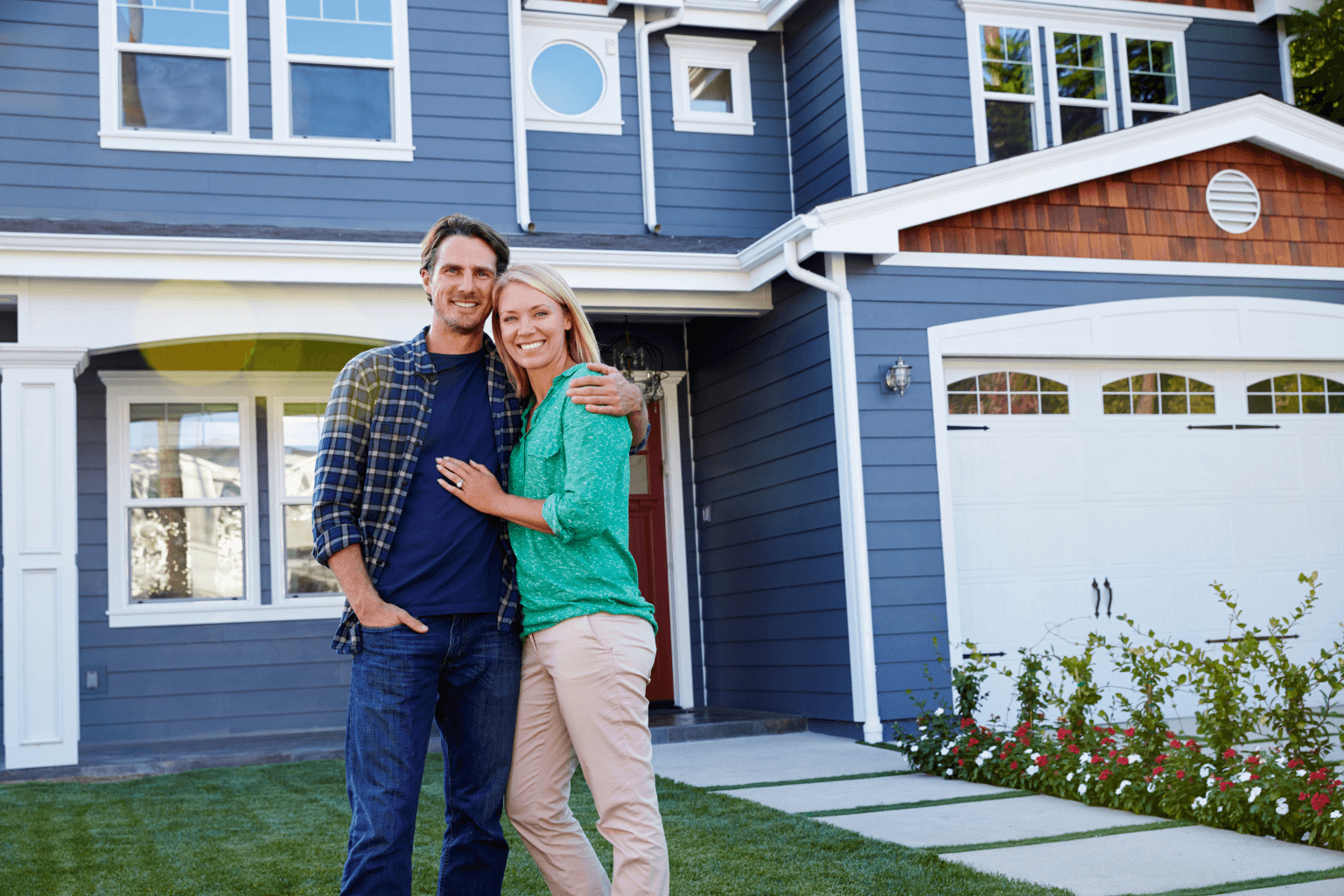 Couple standing in front of inherited home in Californianherited-house-california