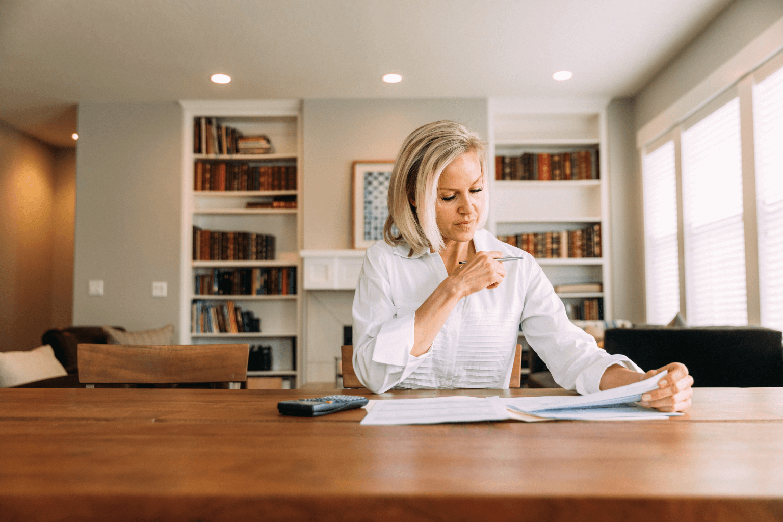 Person reviewing documents to sell house with violations