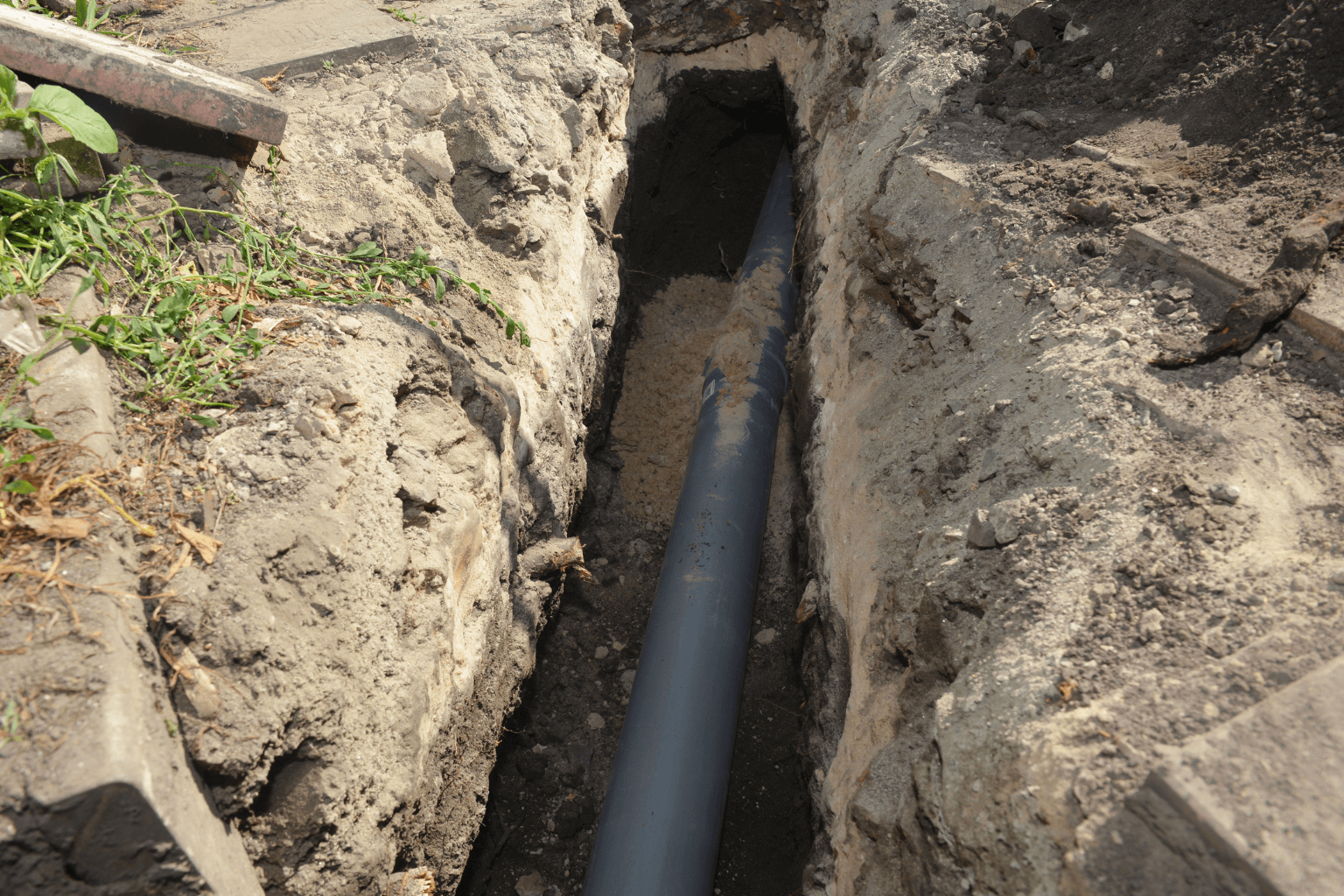 Damaged sewer line pipe dug up for repair