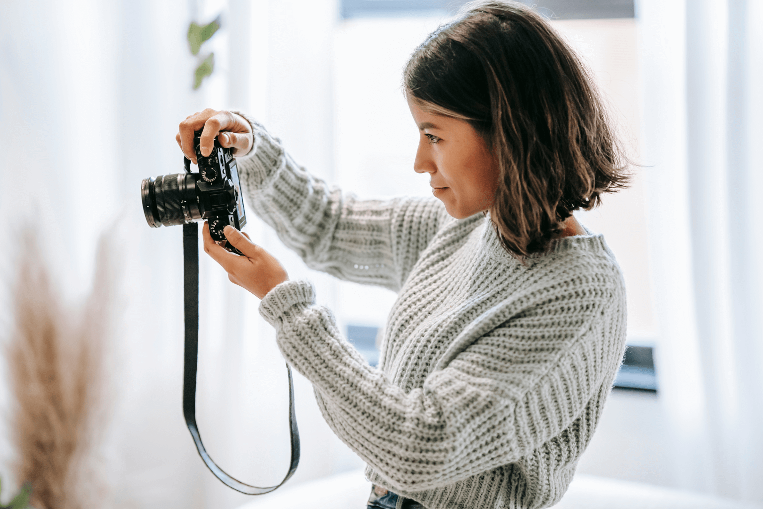 Person taking photos of home damage for documentation