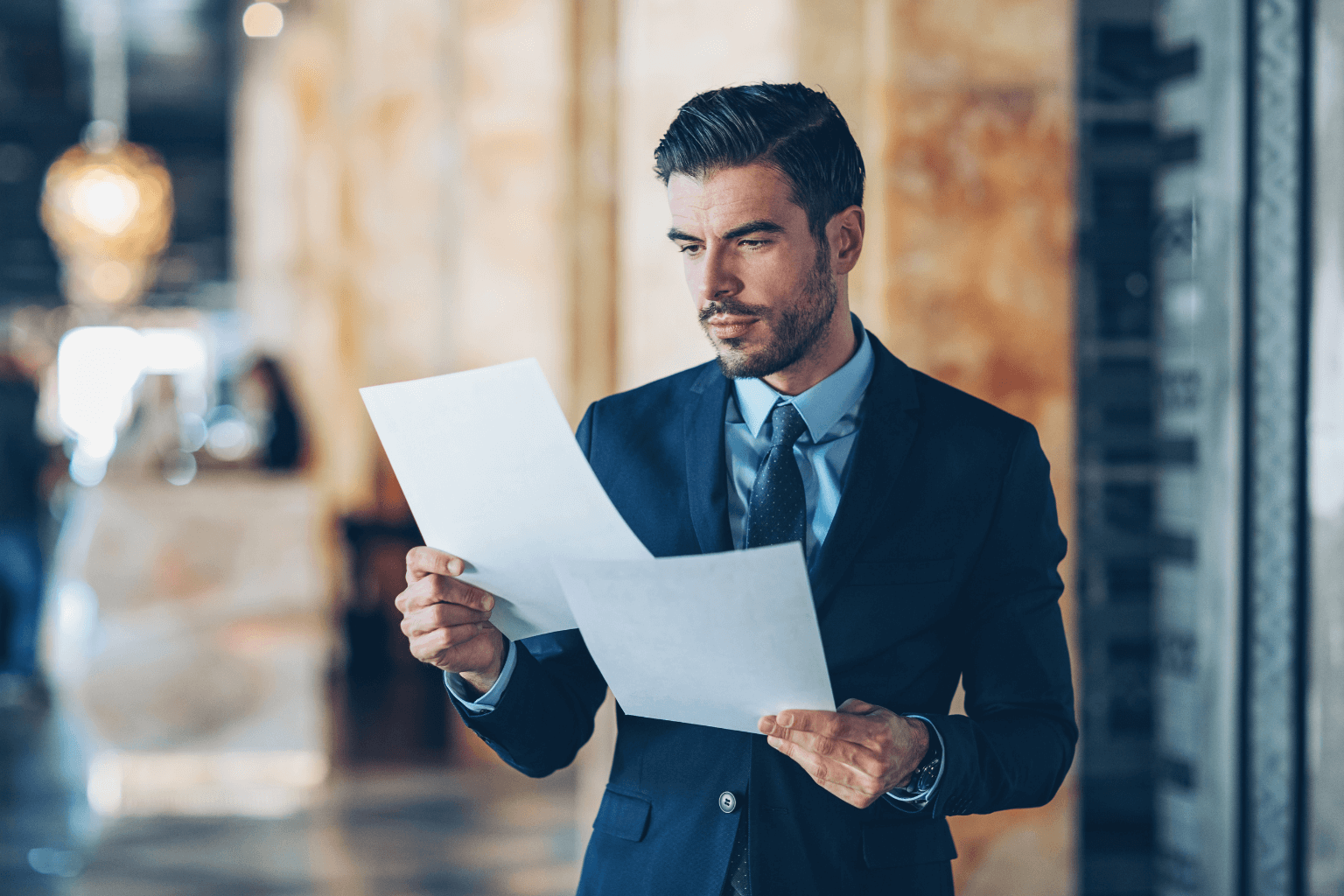 Real estate agent reviewing title documents