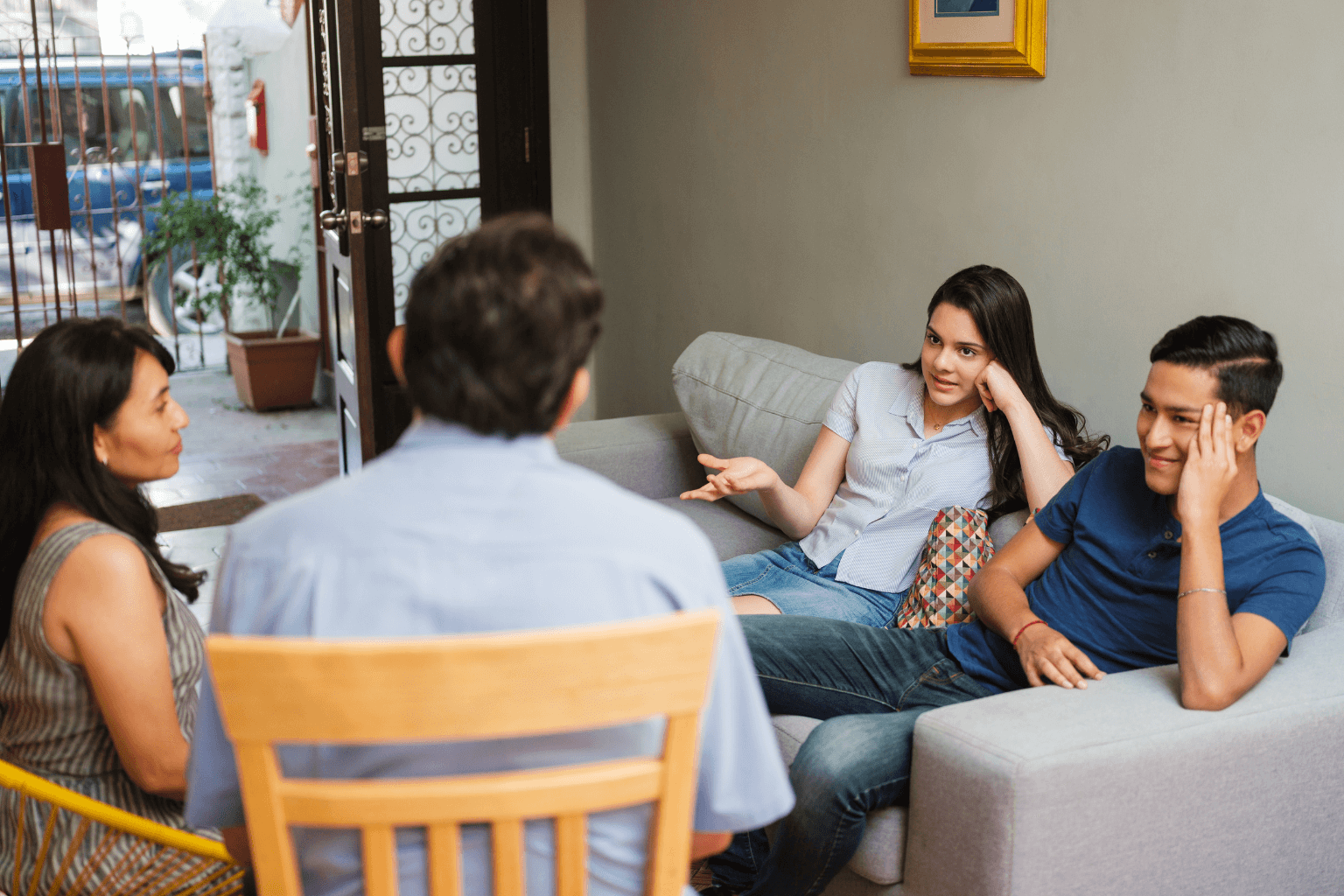 Family members in discussion around a table