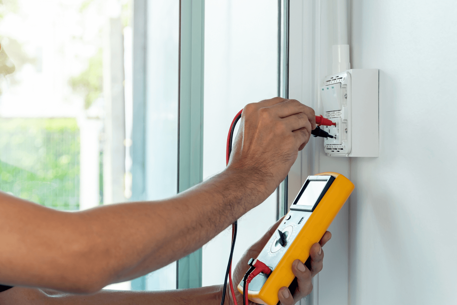 Home inspector checking electrical system in a house