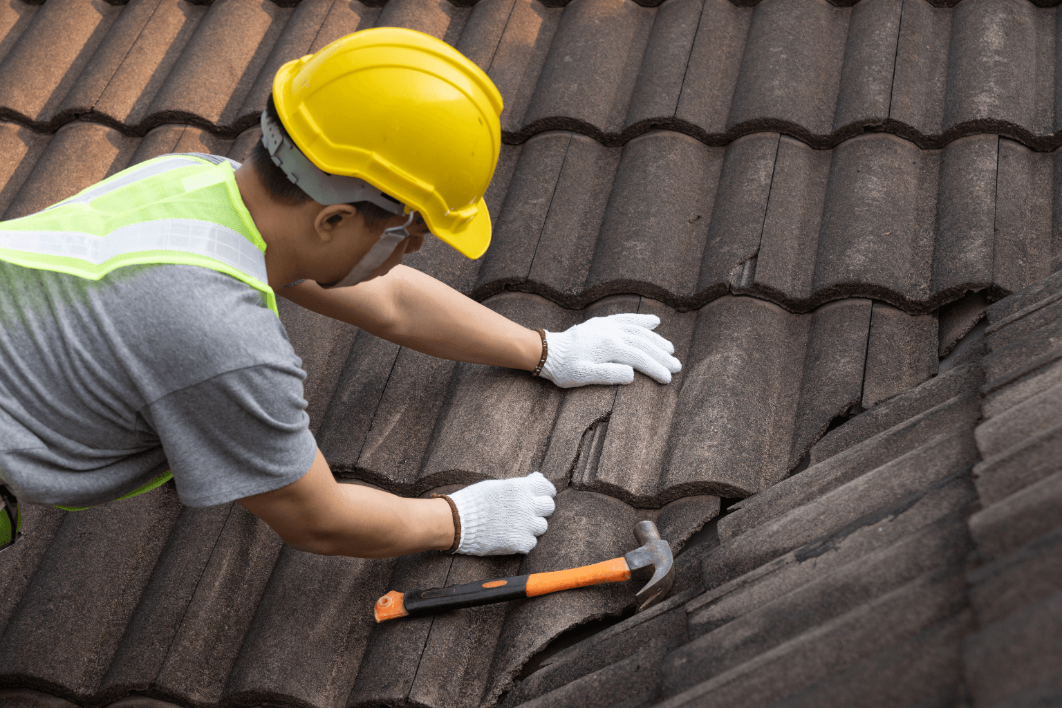 A repair professional fixing a home roof