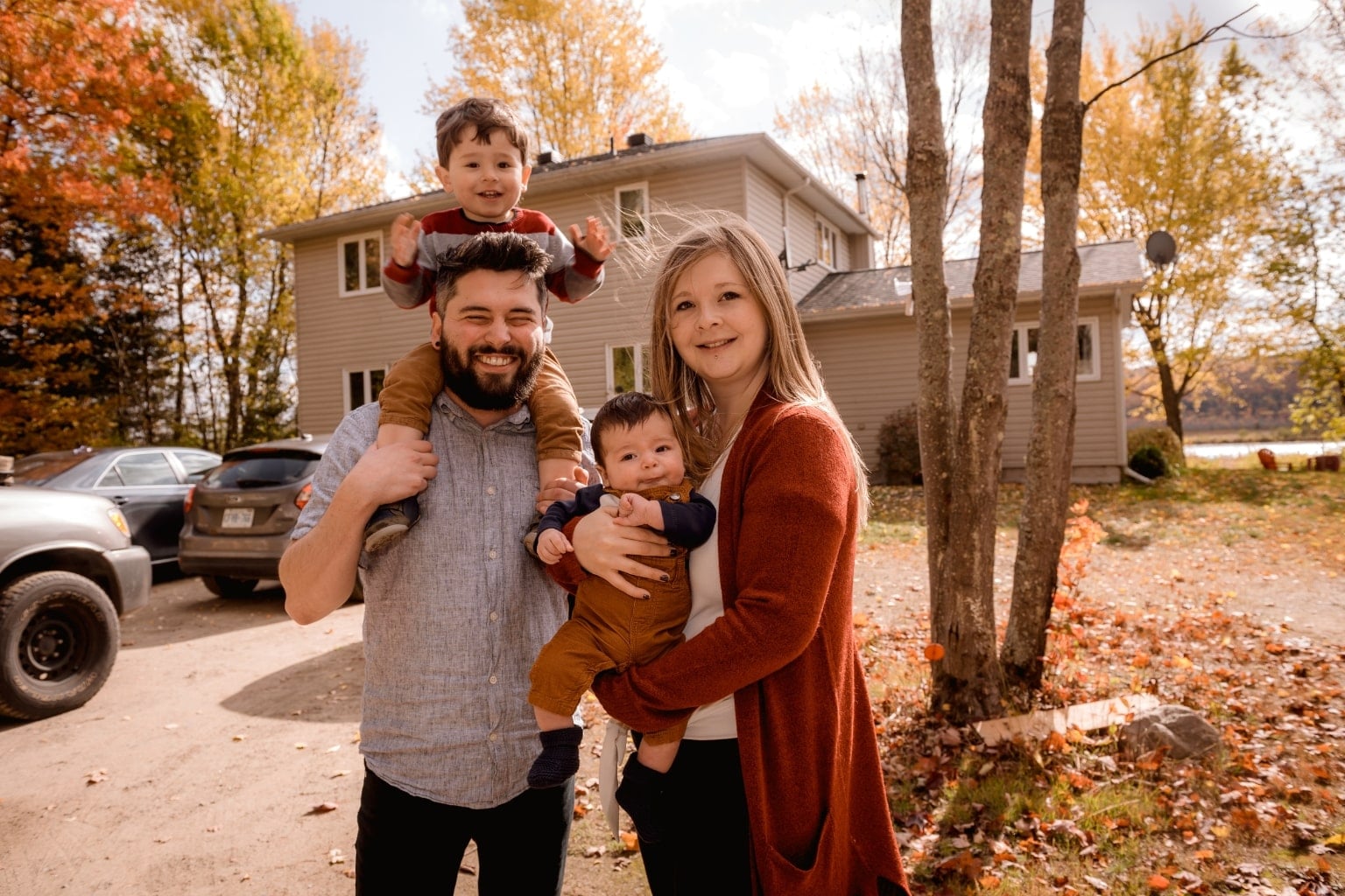 Family standing in front of a house
