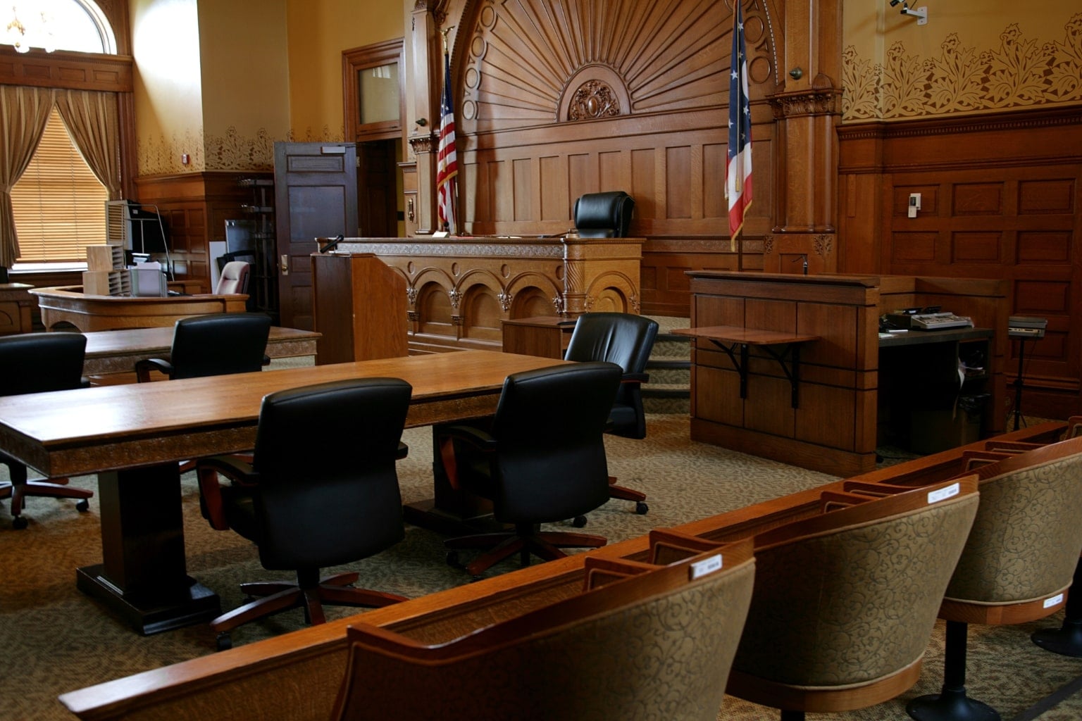 Can One Spouse Sell the House Without Consent in California Empty courtroom interior