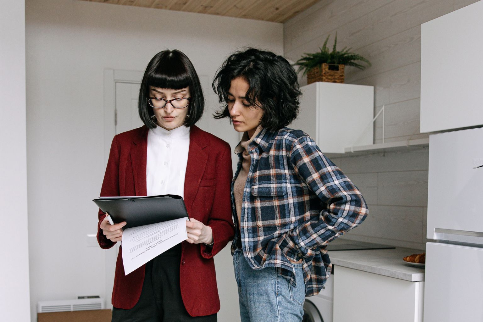 Can You Sell a Home After a Notice of Default in California Homeowner talking with a real estate agent : Can You Sell a Home After a Notice of Default in California