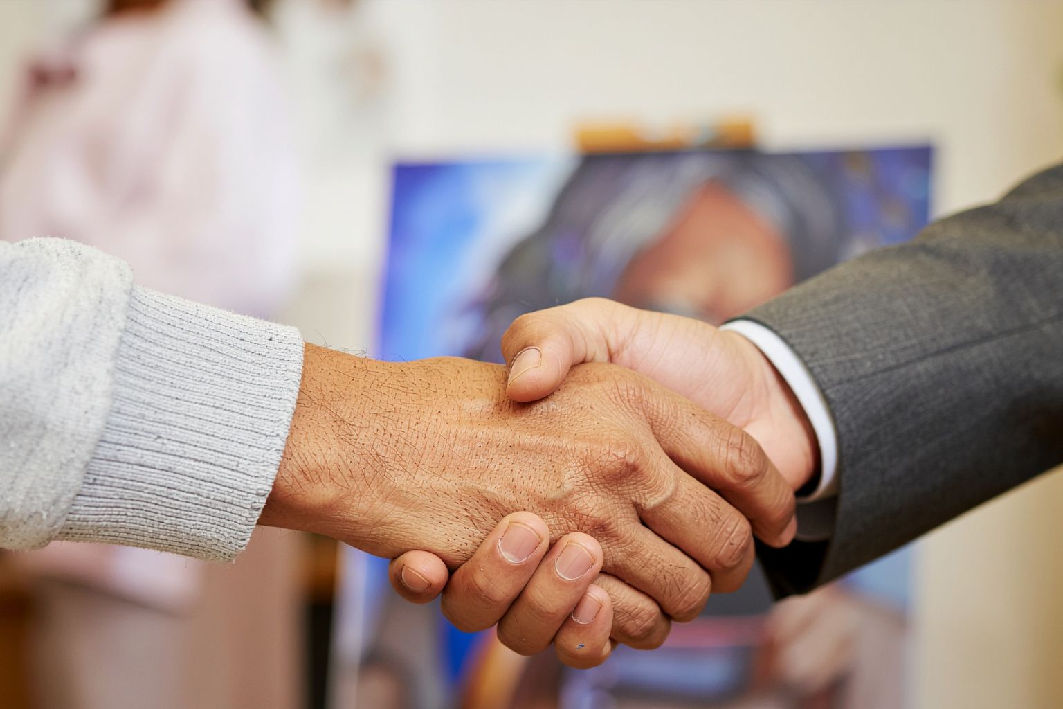Can Siblings Force the Sale of an Inherited Property in California Two people shaking hands