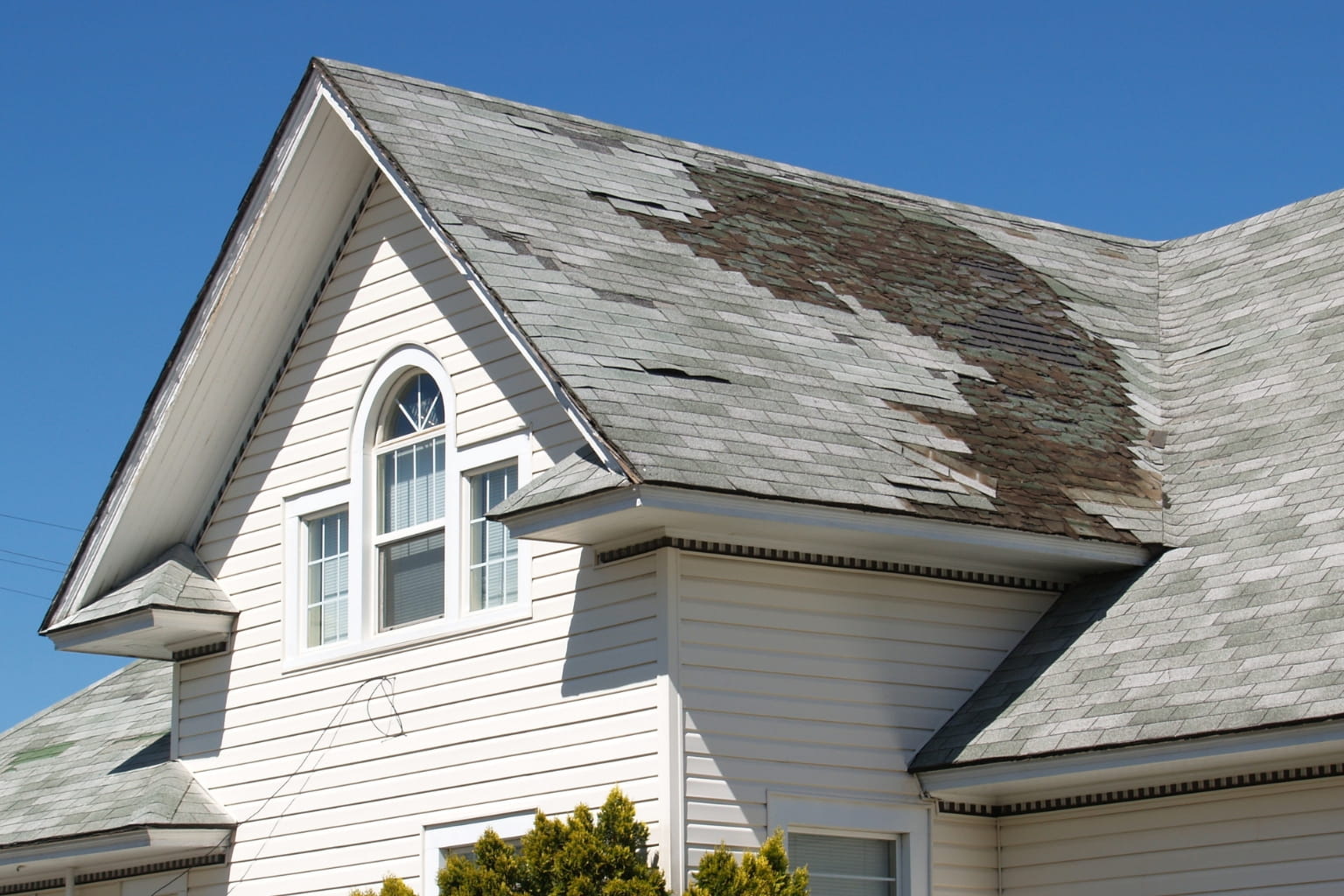 Common Reasons Sellers Sell As-Is in the Bay Area: Old home with visible roof and exterior repairs needed.