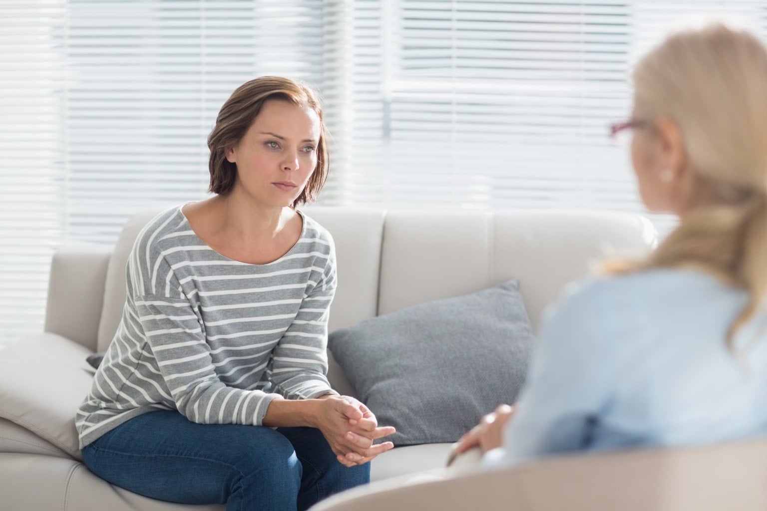 Two people having a calm conversation at a table