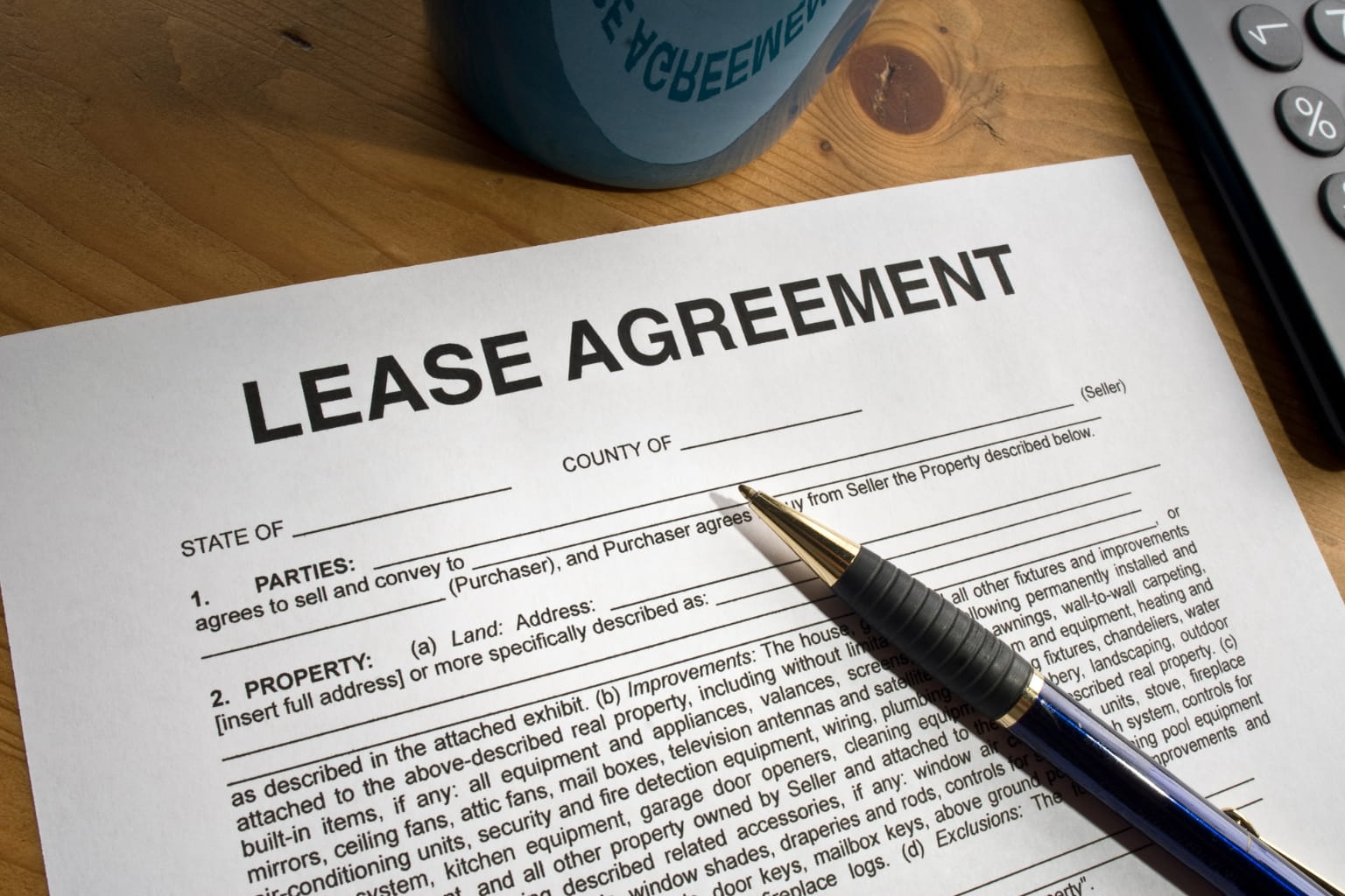 Do You Have to Evict Tenants Before Selling a Rental Property in California? lease agreement on the table | Do You Have to Evict Tenants Before Selling a Rental Property in California?