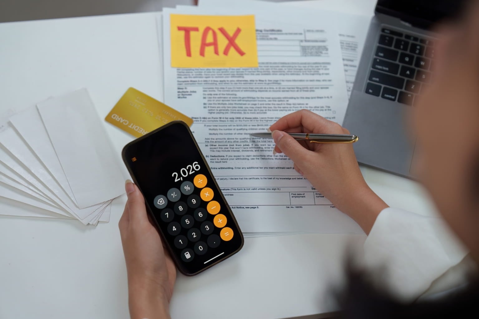Property tax bill paperwork on a table with calculator | Property Taxes in California