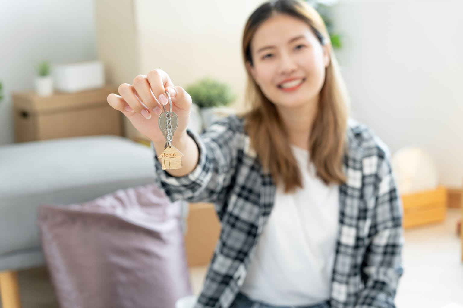 Sell a Home for Cash in the Bay Area Happy homeowner holding keys