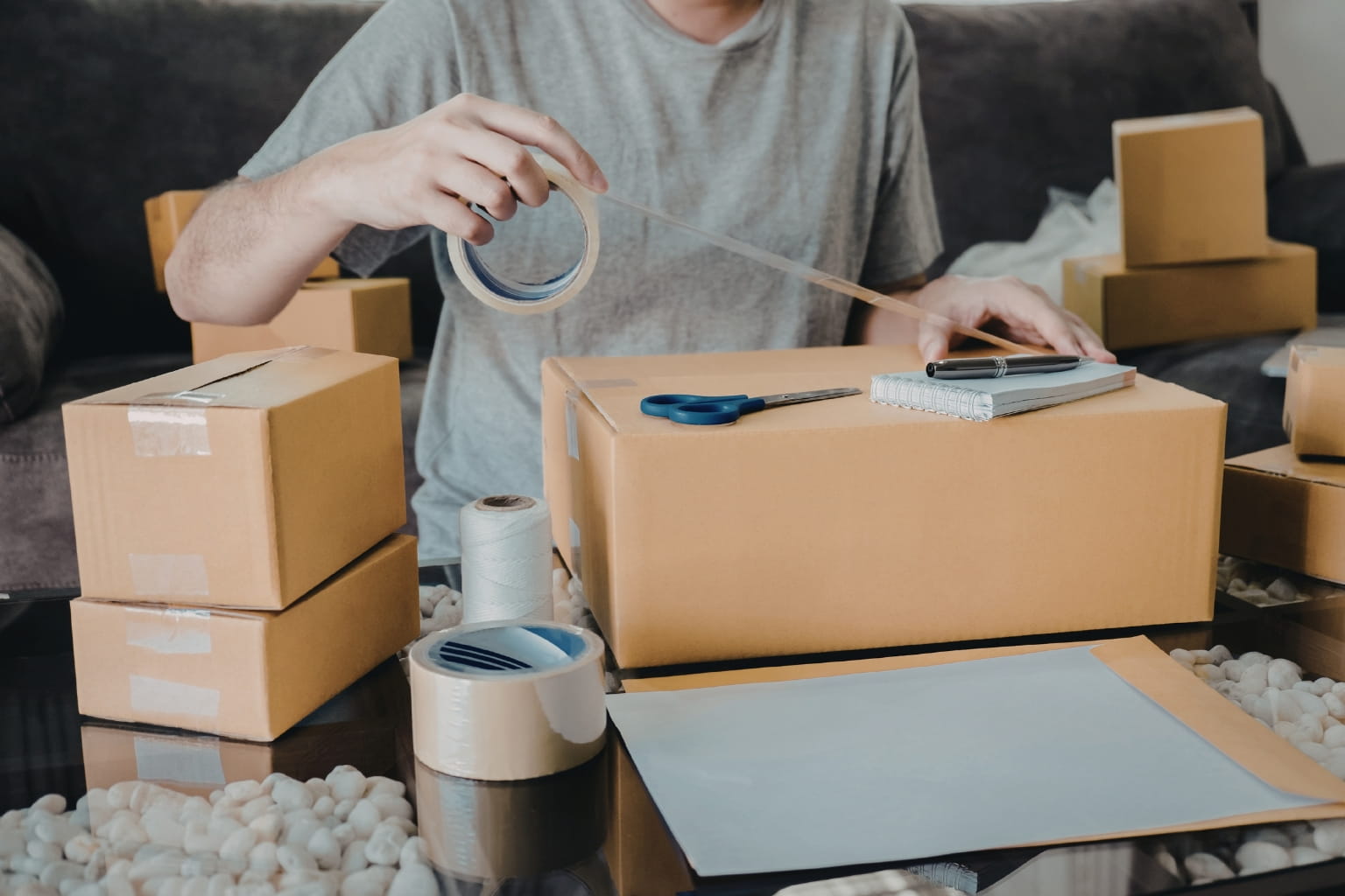 Homeowner packing boxes