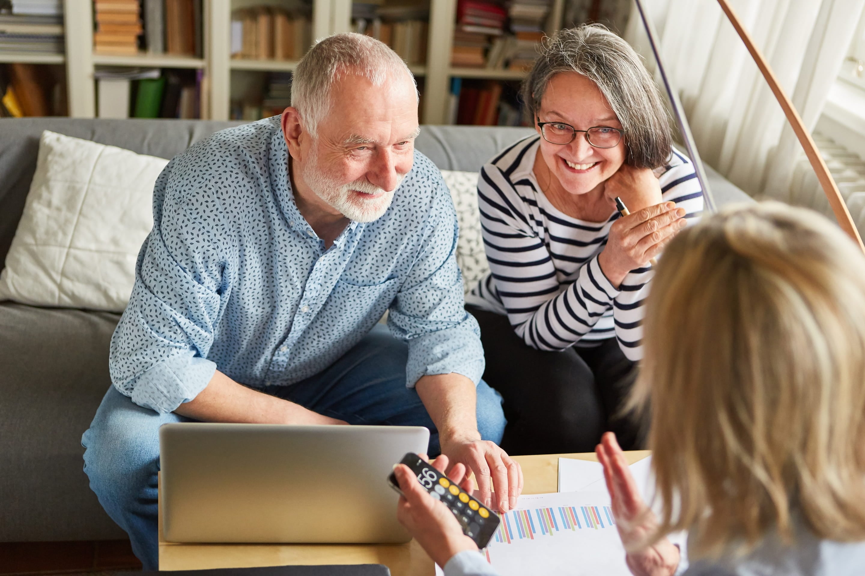 Homeowner meeting with real estate agent at desk