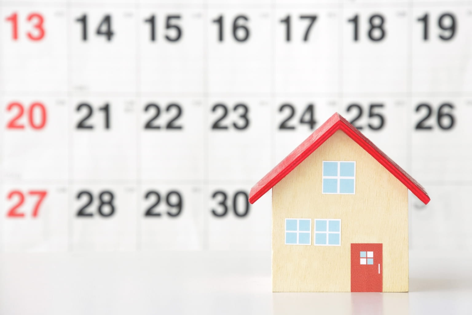 Calendar and house model on desk | How to Handle Inheritance Disputes 
