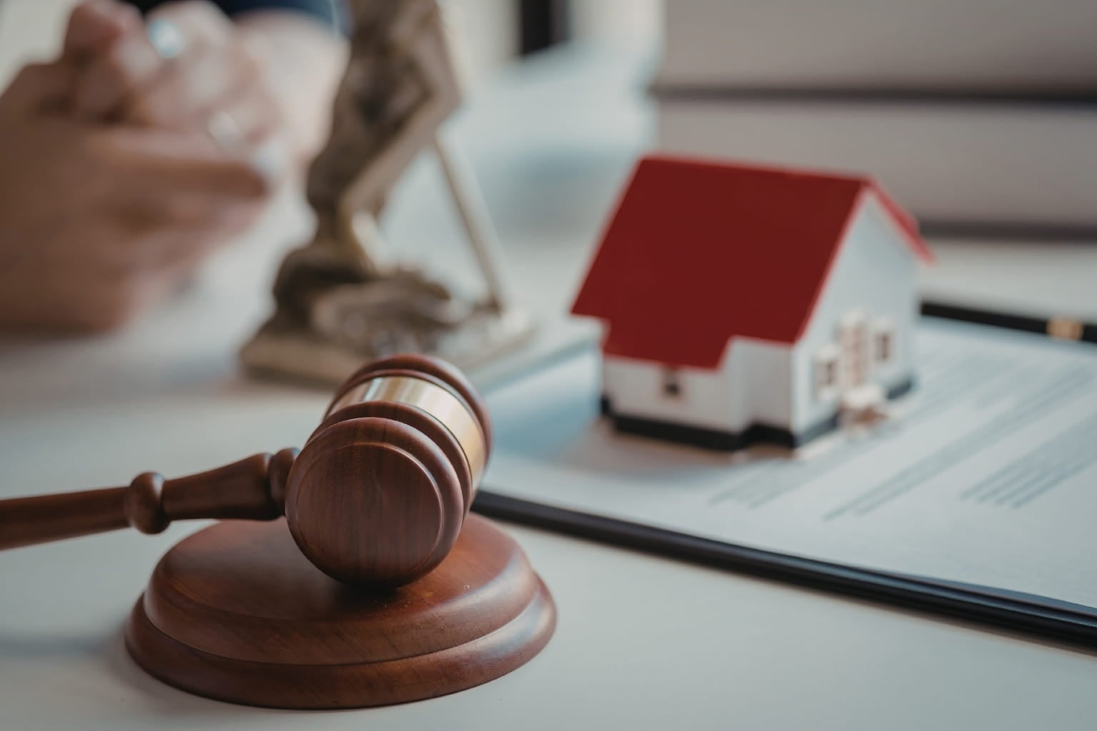 house model and gavel on a desk | How to Divide Home Sale Proceeds During Divorce in California