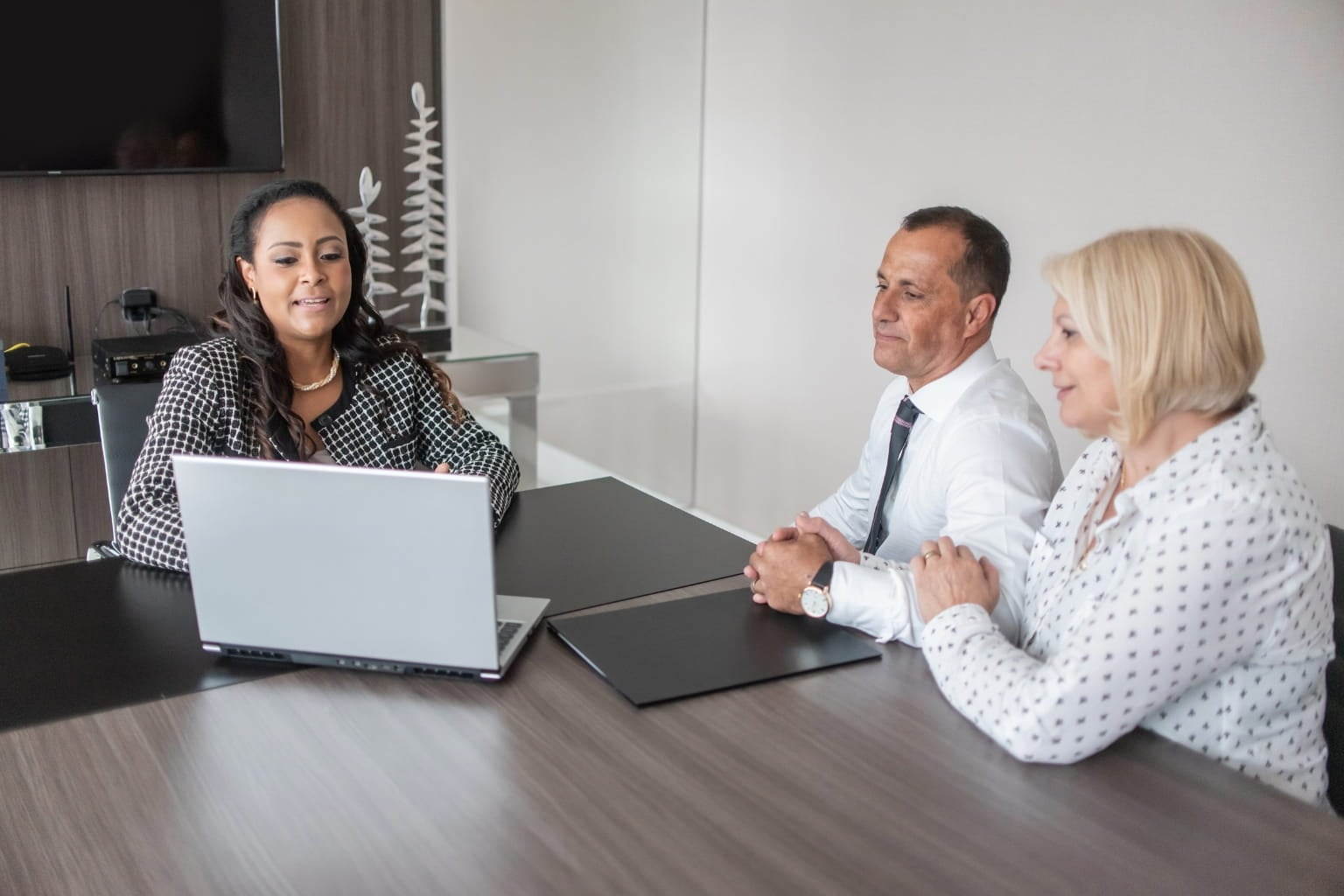 Tax professional discussing finances with a client in office