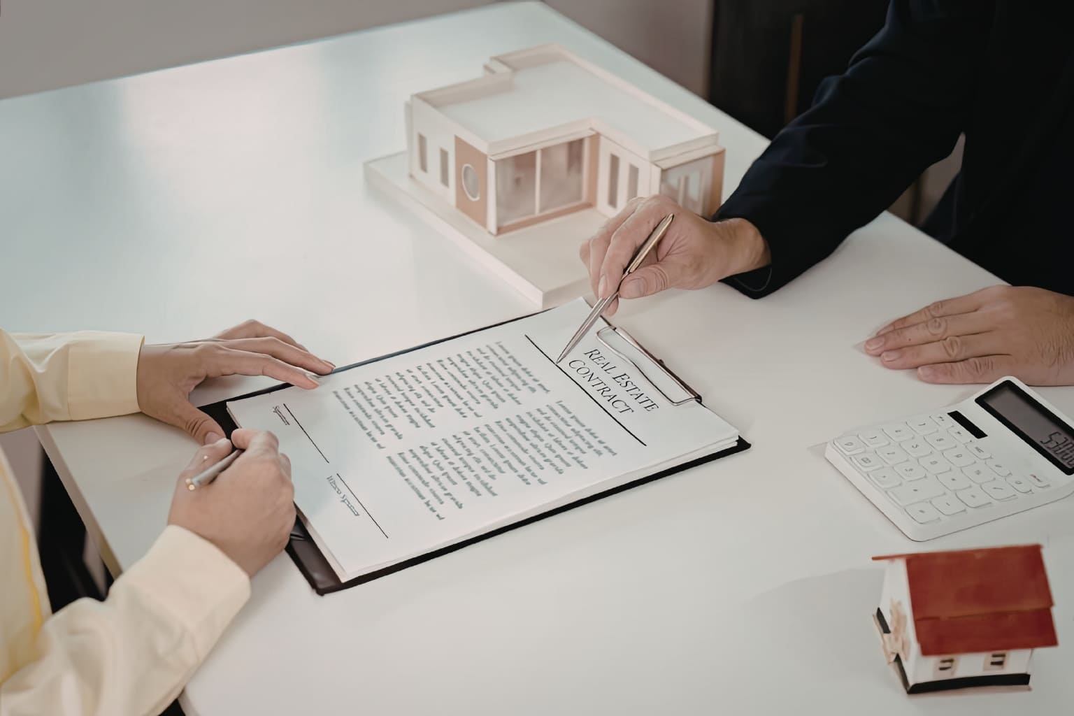 Cash Buyers in the Bay Area person signing a house contract