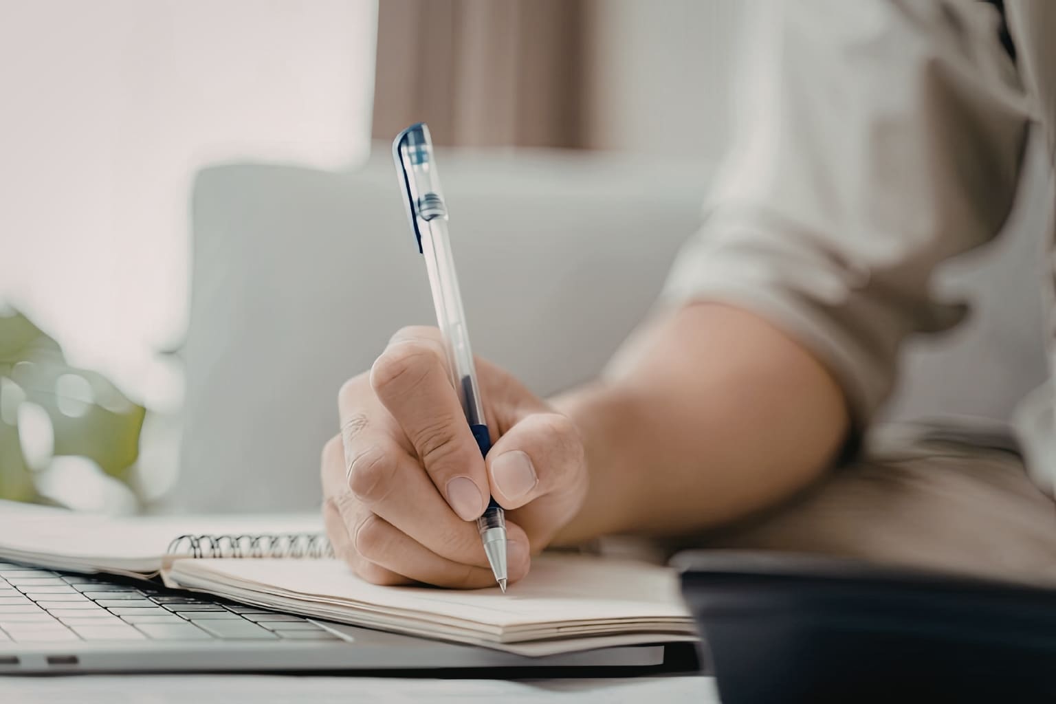 Cash Buyers in the Bay Area person writing on a notebook