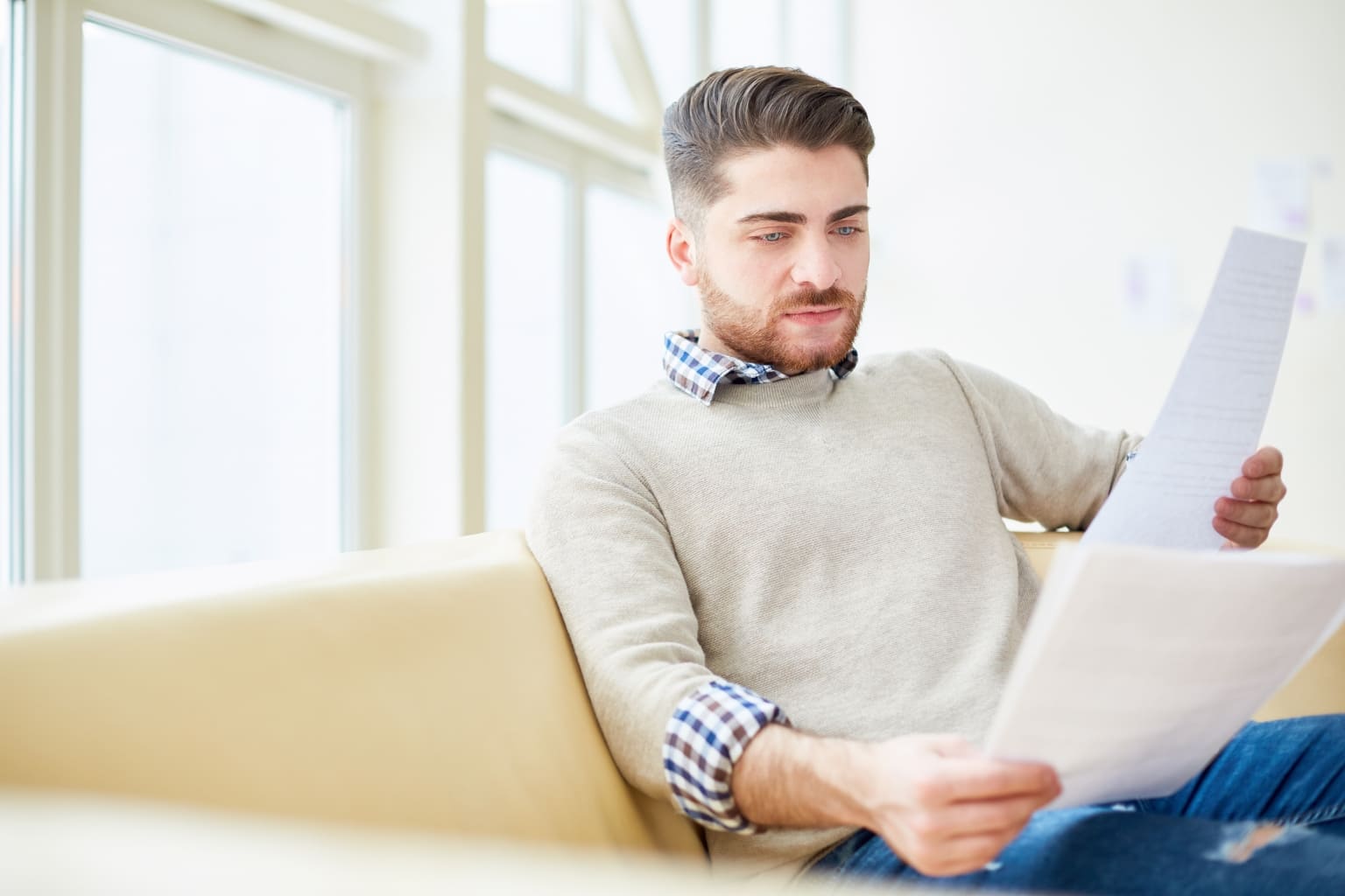 Person reviewing documents calmly | Why Speed Matters When Selling a House in High-Stress Situations