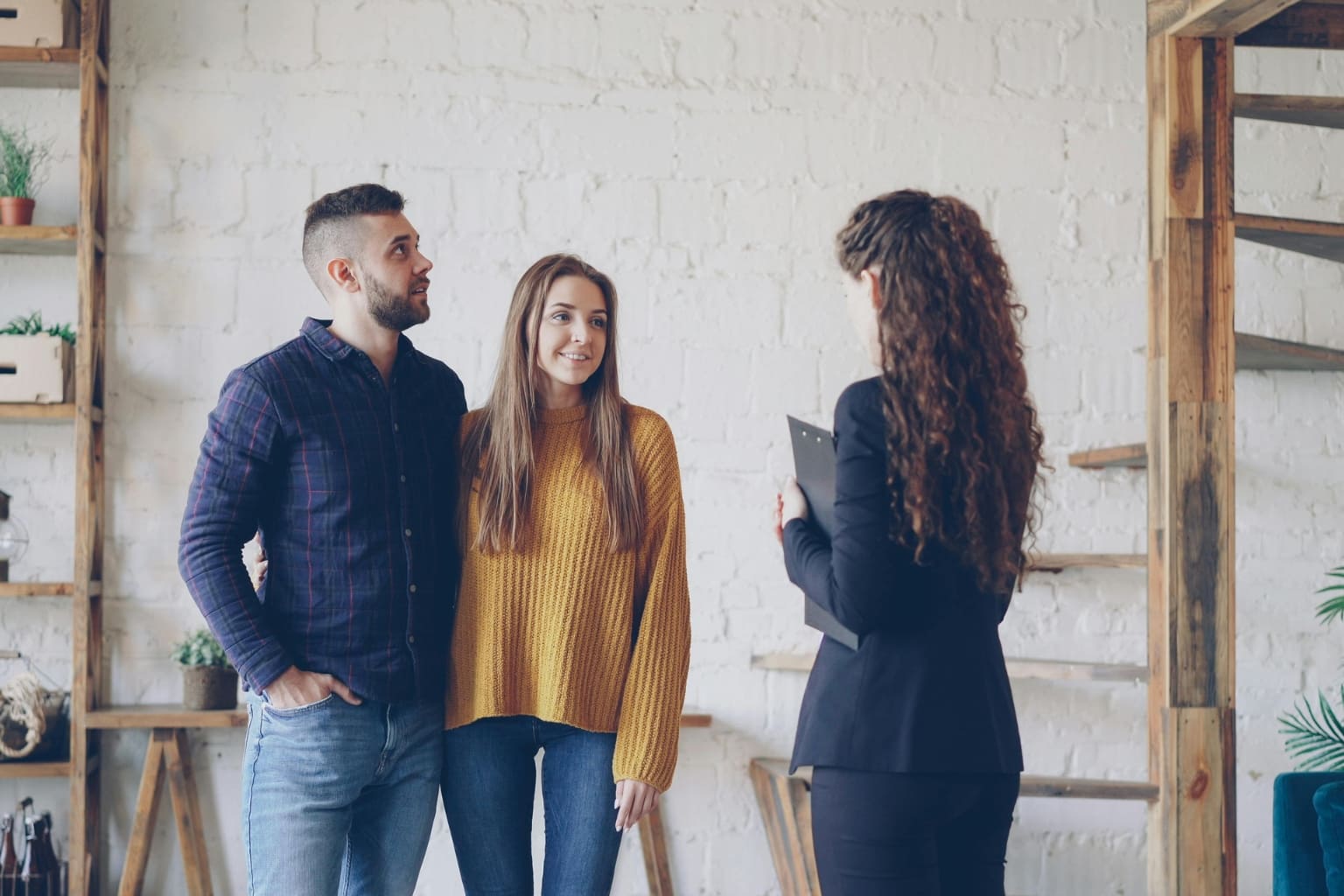 best way to sell a distressed property in the Bay Area Homeowner talking with real estate agent |