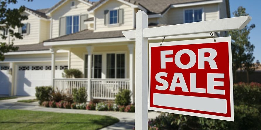 Home For Sale Sign in Front of New House.