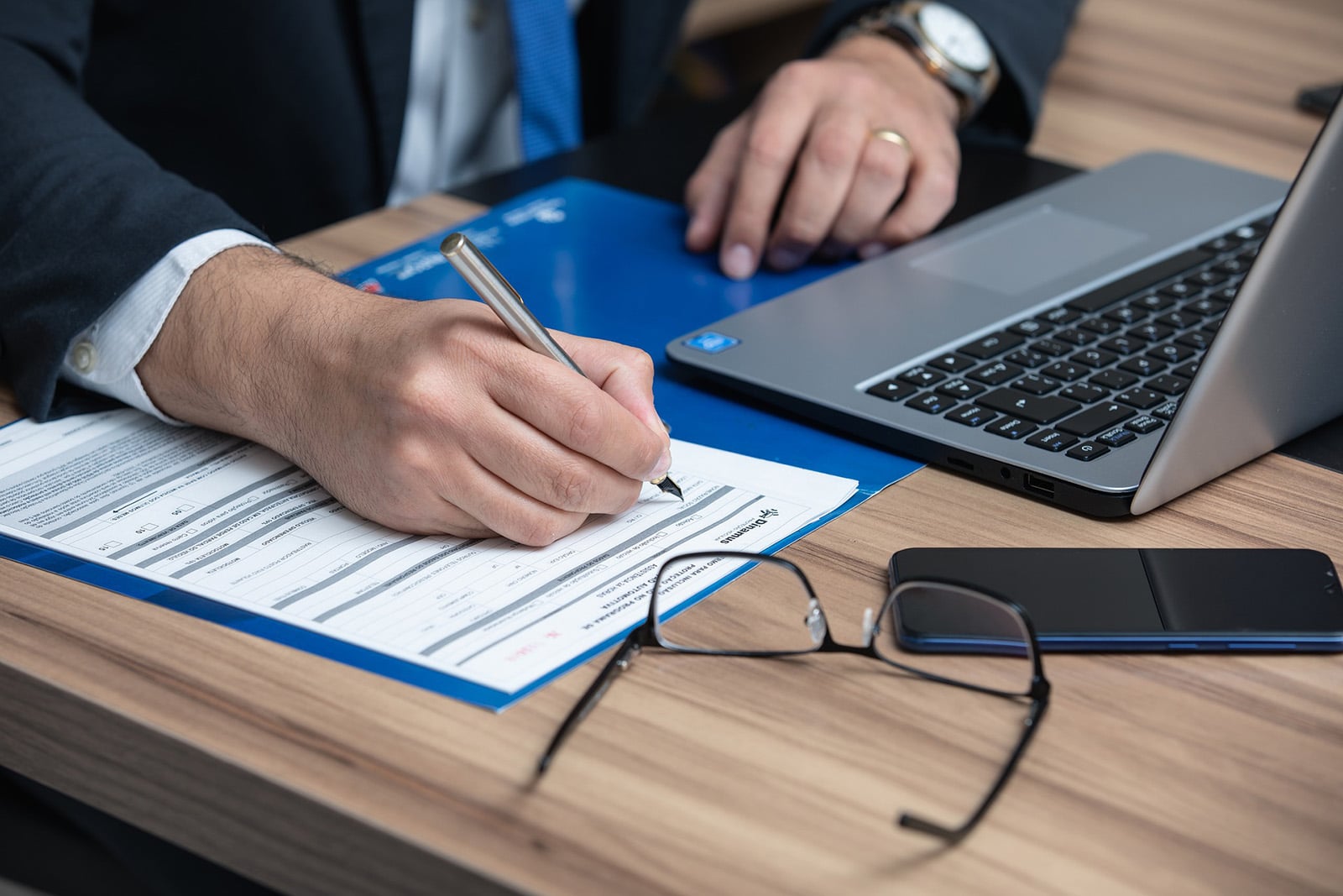 Man-with-laptop-reviewing-probate-documents