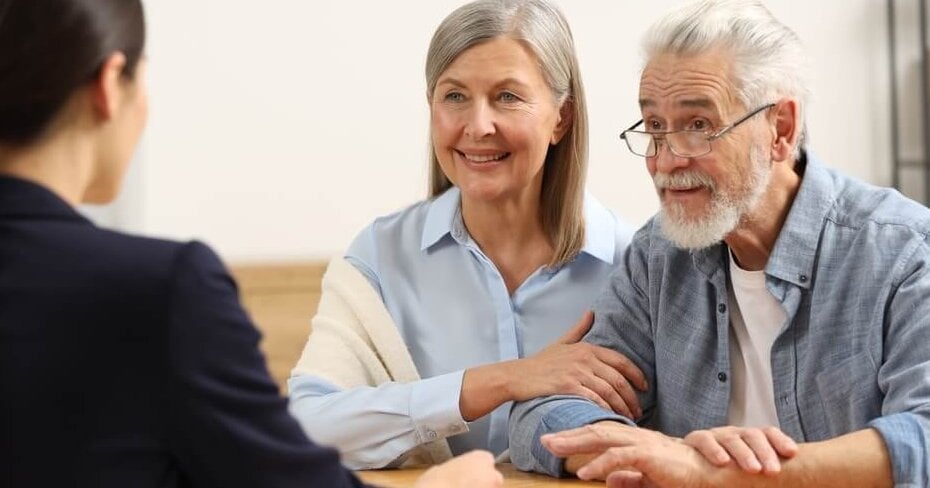 Notary consulting senior couple about Last Will and Testament in office_0