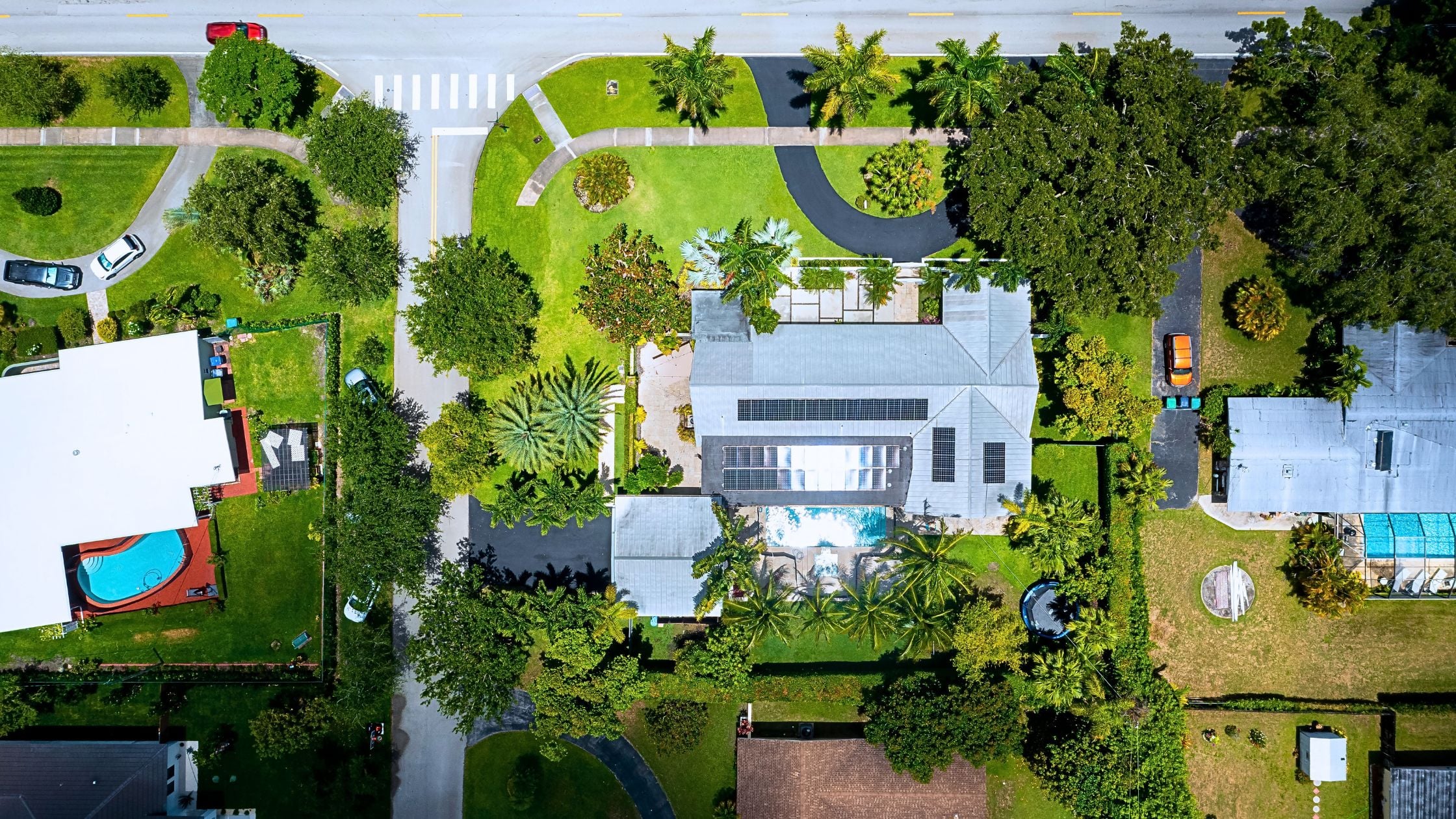 Tree-lined residential street in Pinecrest Miami representing living in Pinecrest Miami lifestyle