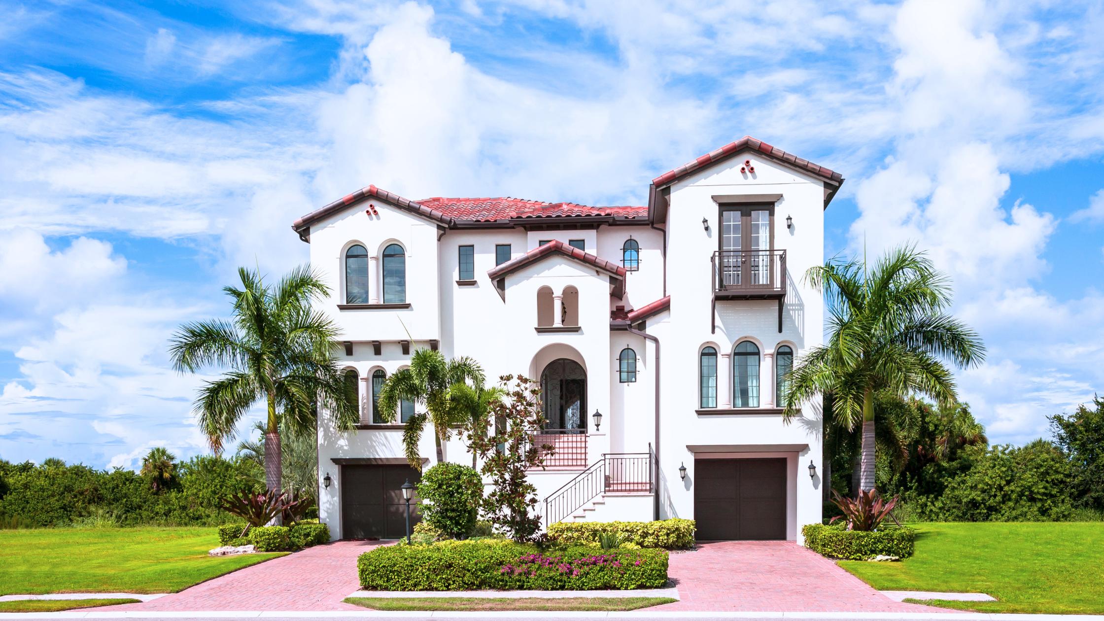 Mediterranean Revival home with barrel-tile roof on a tree-lined Shenandoah Miami street, the kind of stock that anchors selling a home in Shenandoah Miami.