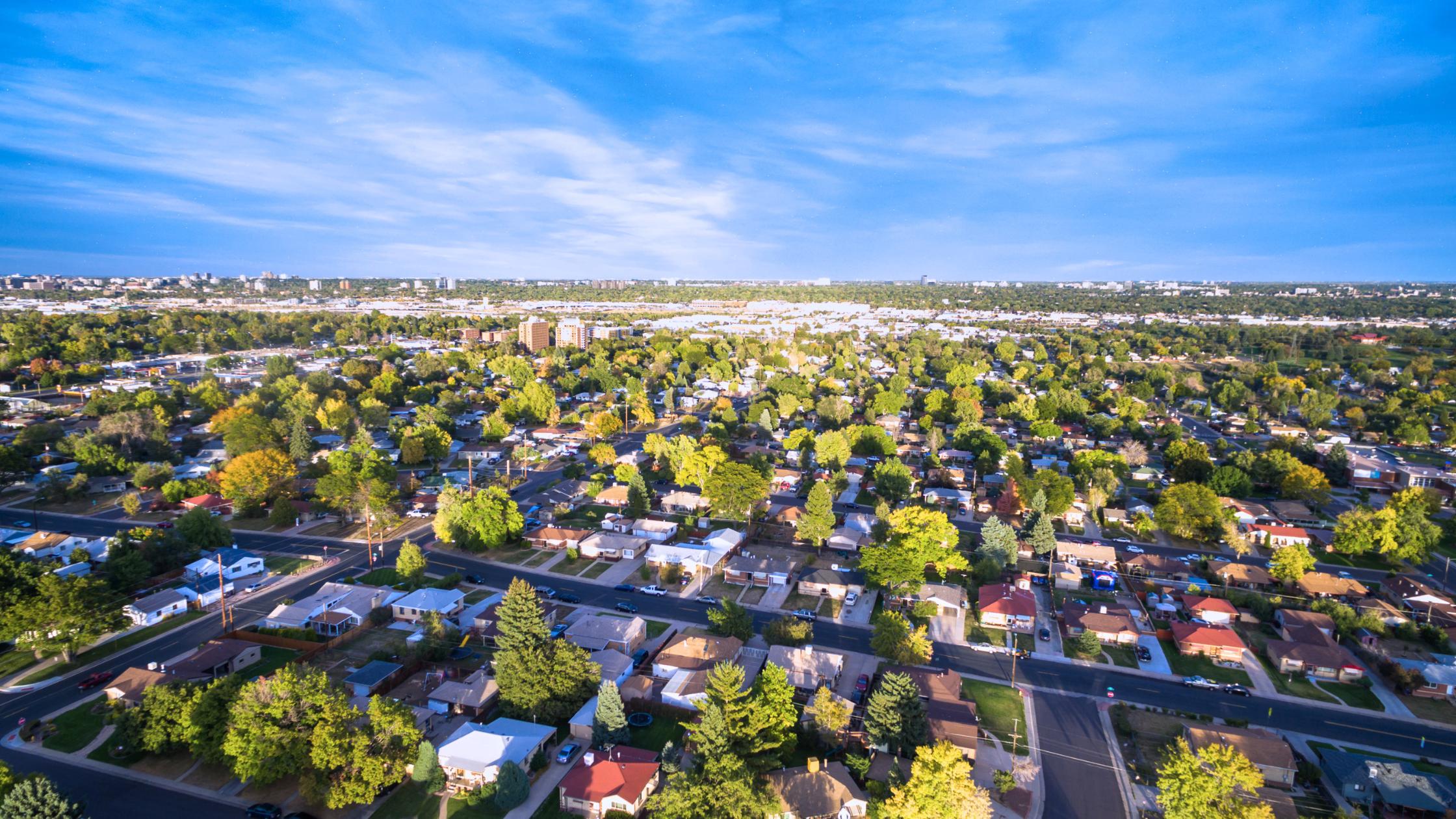 Aerial view of a single-family Glenvar Heights Miami home on a large lot with mature trees and a green yard.