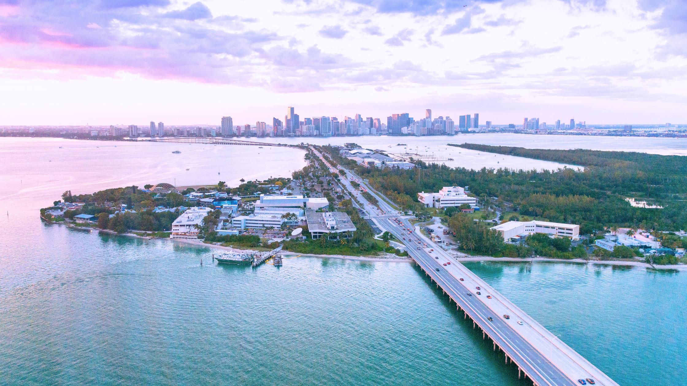 Aerial view of North Bay Village's three islands on Biscayne Bay with the causeway and condo towers, key market for selling a home in North Bay Village