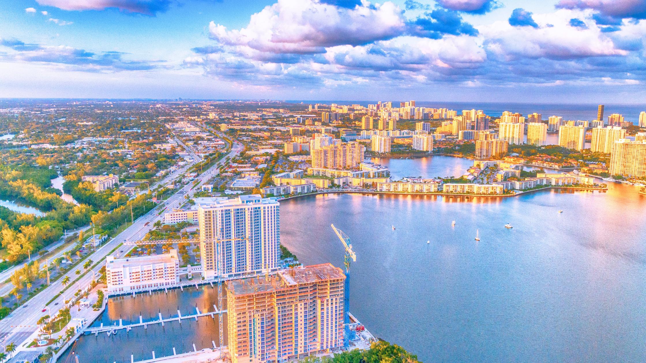 Miami skyline with condo towers and single-family neighborhoods showing the 2026 two-speed housing market.