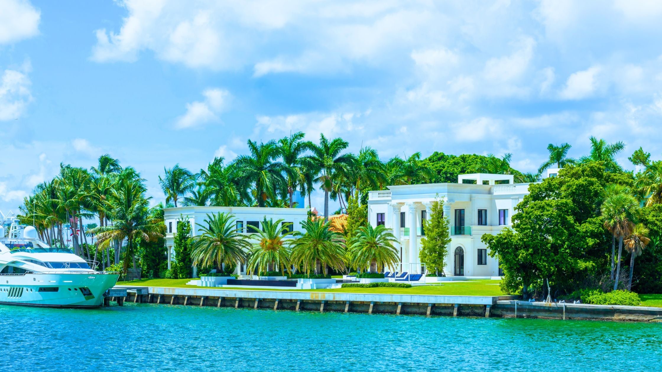 Miami waterfront home with private dock and open water view at golden hour