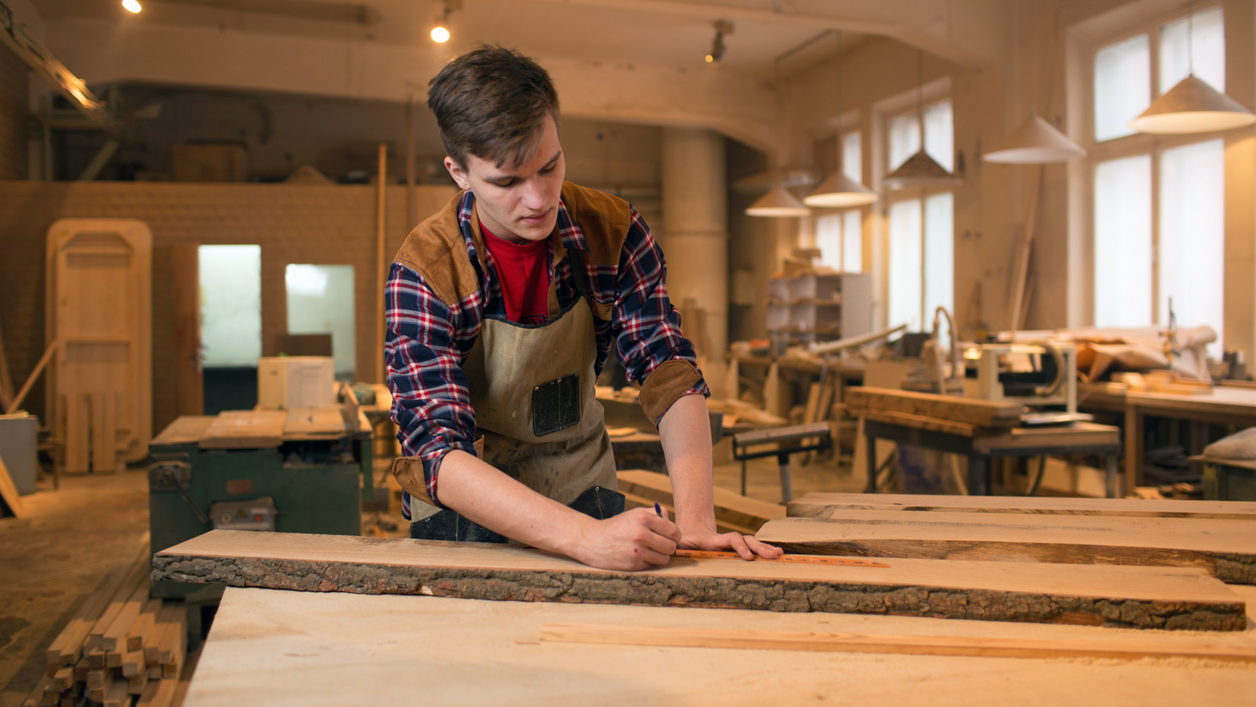 Carpenter is studying,works with the tools without protection