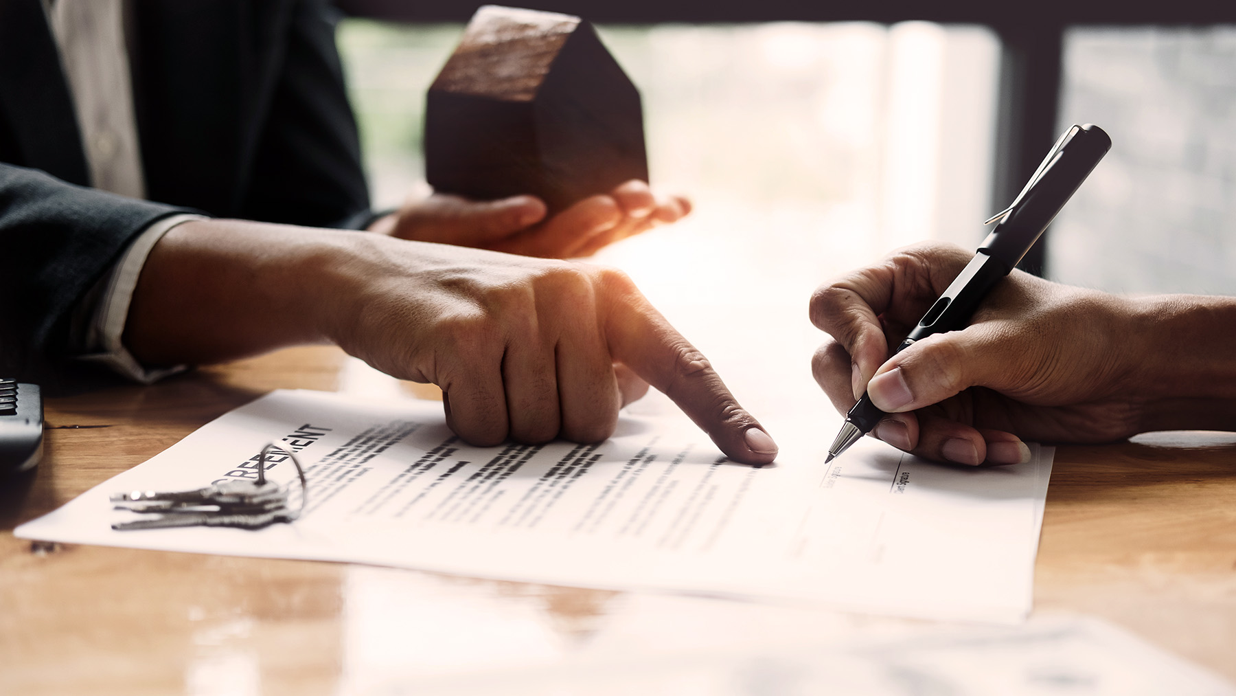Businessman and estate agent signing a document for house deal, vintage filter effect